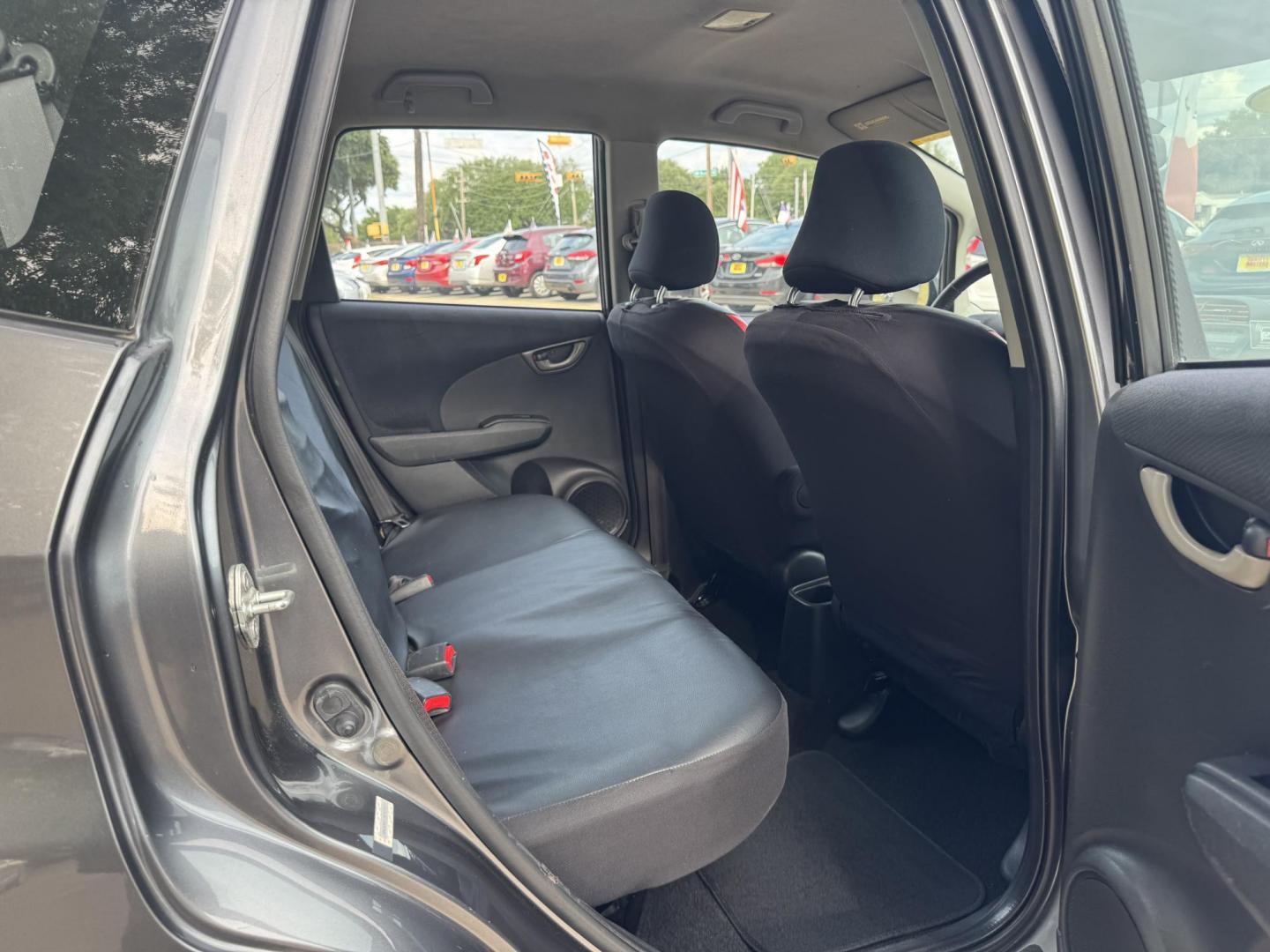 2011 Gray /Black Honda Fit Sport 5-Speed AT (JHMGE8H52BC) with an 1.5L L4 SOHC 16V engine, 5-Speed Automatic transmission, located at 16710 Clay Rd., Houston, TX, 77084, (281) 859-7900, 29.834864, -95.656166 - Photo#14