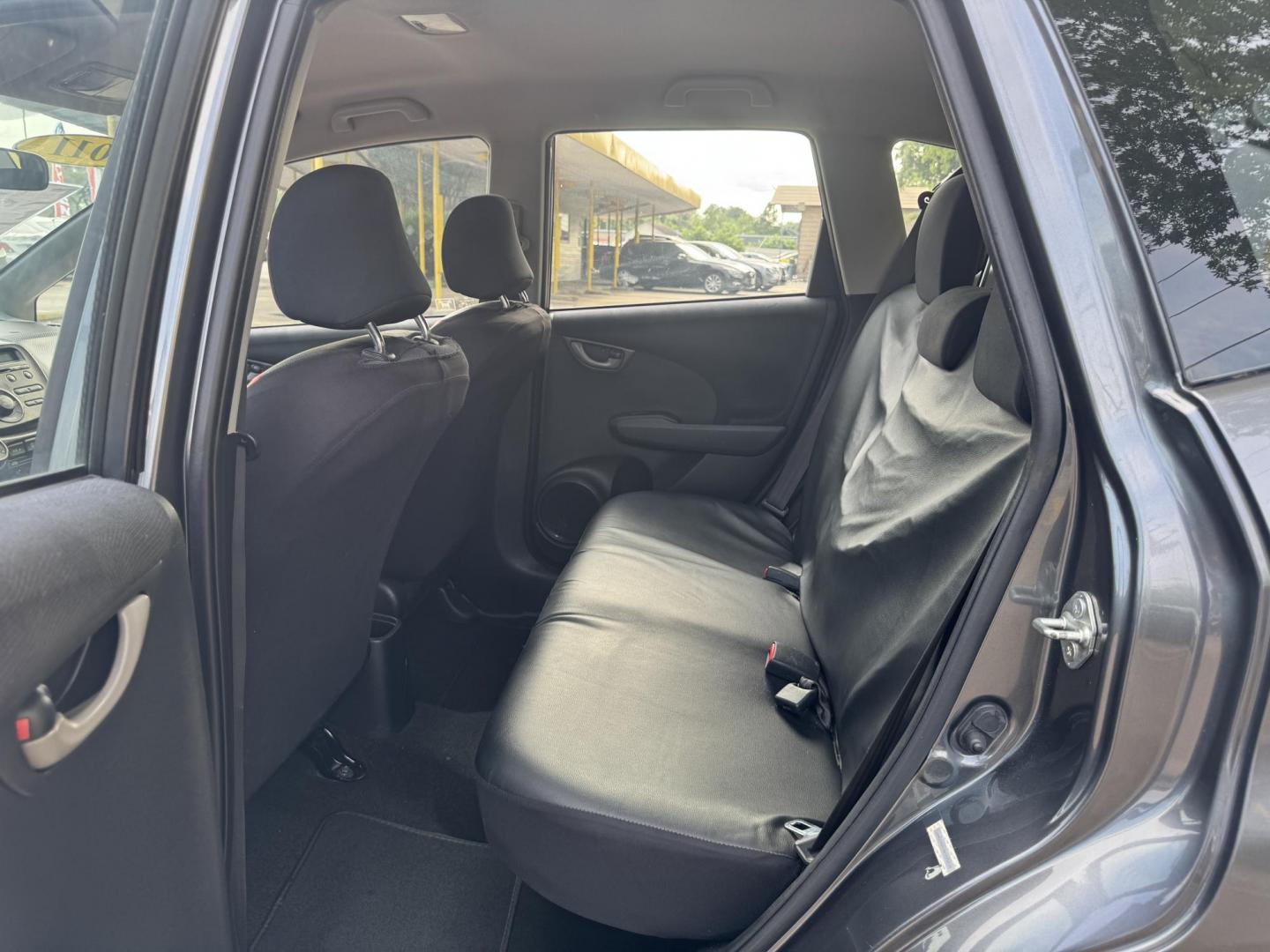 2011 Gray /Black Honda Fit Sport 5-Speed AT (JHMGE8H52BC) with an 1.5L L4 SOHC 16V engine, 5-Speed Automatic transmission, located at 16710 Clay Rd., Houston, TX, 77084, (281) 859-7900, 29.834864, -95.656166 - Photo#13