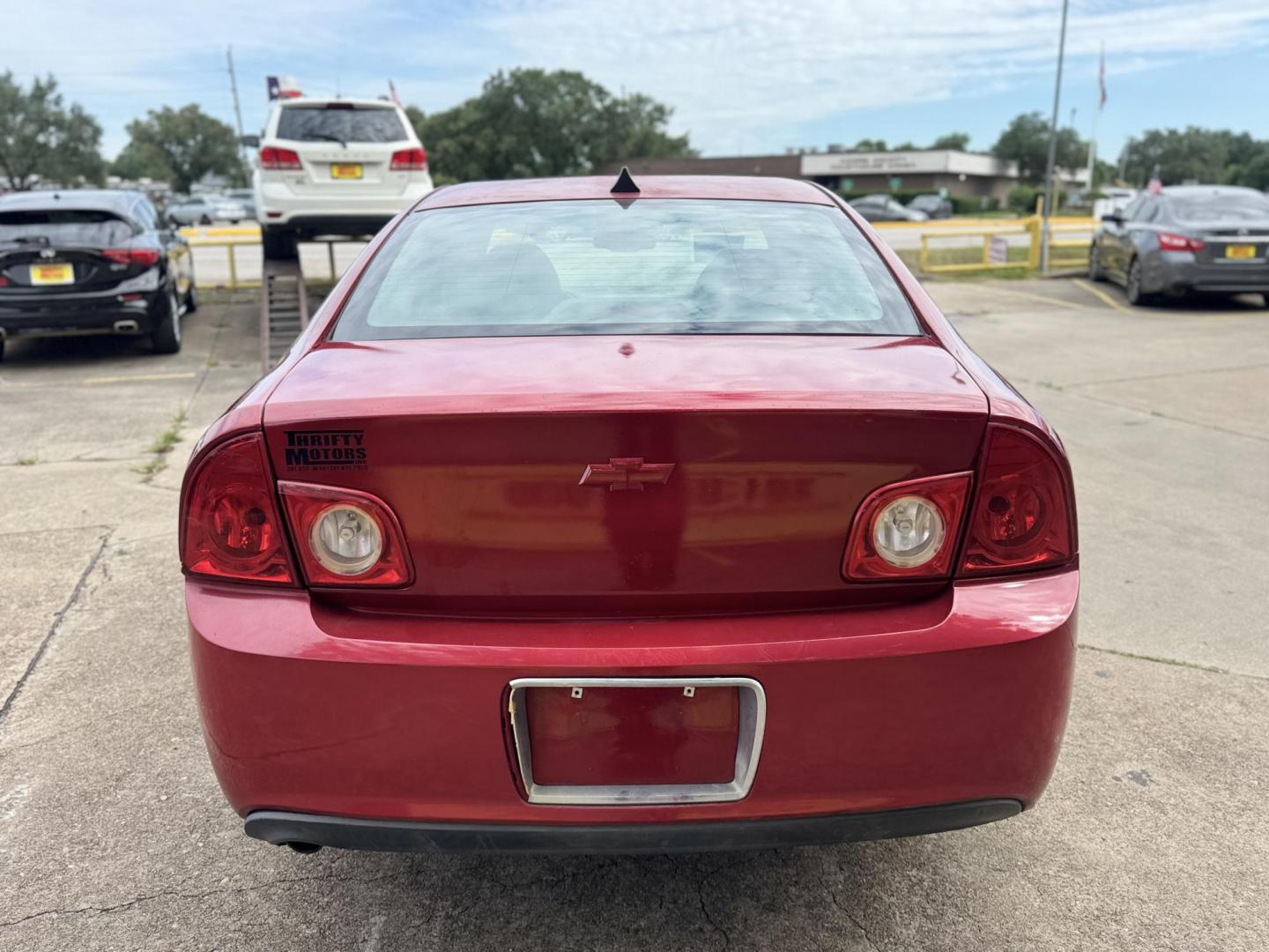 2012 Red /Black Chevrolet Malibu 1LTZ (1G1ZE5E09CF) with an 2.4L L4 DOHC 16V engine, 6-Speed Automatic transmission, located at 16710 Clay Rd., Houston, TX, 77084, (281) 859-7900, 29.834864, -95.656166 - Photo#3