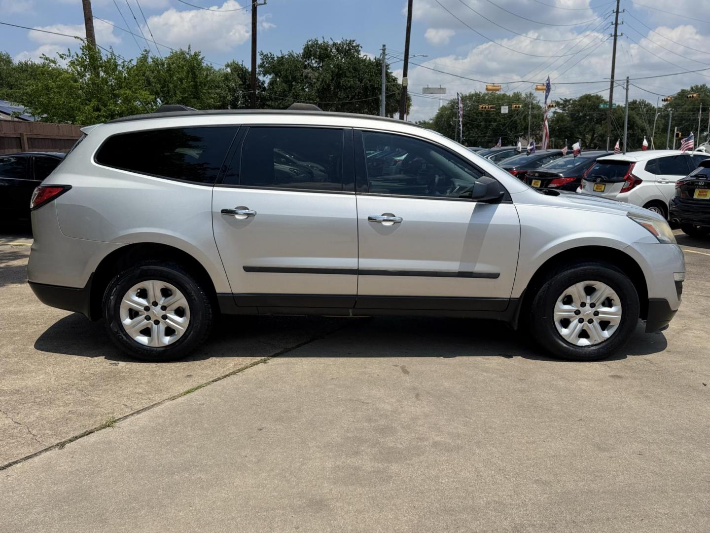 2016 Silver /Gray Chevrolet Traverse LS FWD (1GNKRFKD4GJ) with an 3.6L V6 DOHC 24V engine, 6A transmission, located at 16710 Clay Rd., Houston, TX, 77084, (281) 859-7900, 29.834864, -95.656166 - Photo#3