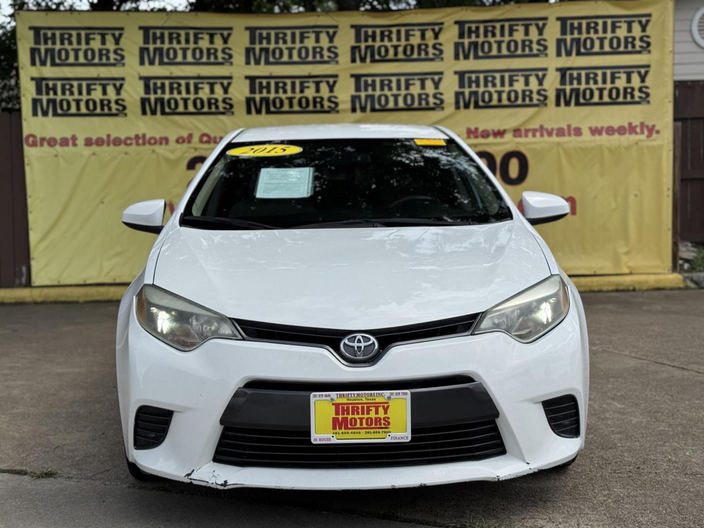2015 White /Tan Toyota Corolla L 4-Speed AT (2T1BURHE9FC) with an 1.8L L4 DOHC 16V engine, 4-Speed Automatic transmission, located at 16710 Clay Rd., Houston, TX, 77084, (281) 859-7900, 29.834864, -95.656166 - Photo#0