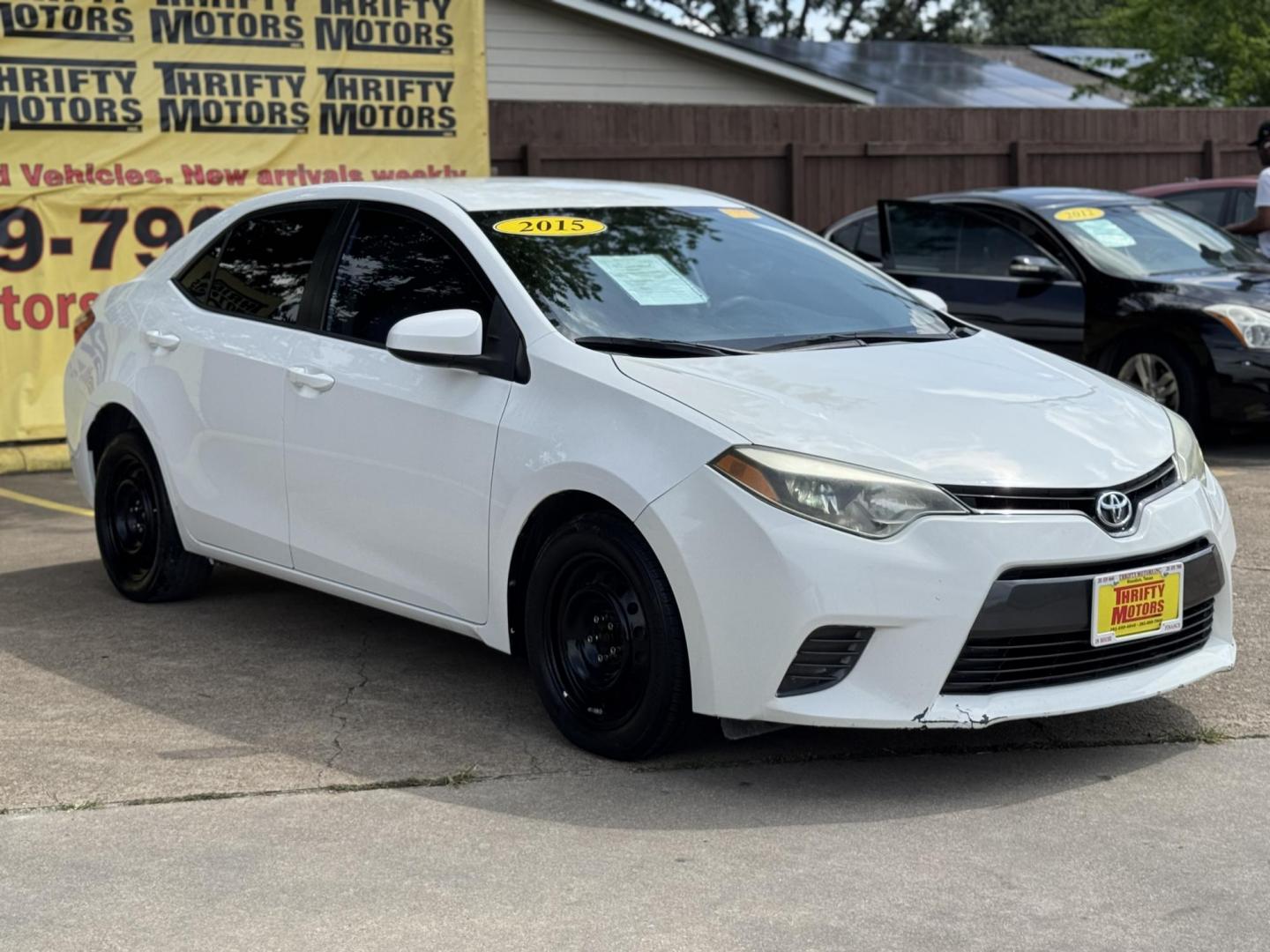 2015 White /Tan Toyota Corolla L 4-Speed AT (2T1BURHE9FC) with an 1.8L L4 DOHC 16V engine, 4-Speed Automatic transmission, located at 16710 Clay Rd., Houston, TX, 77084, (281) 859-7900, 29.834864, -95.656166 - Photo#2