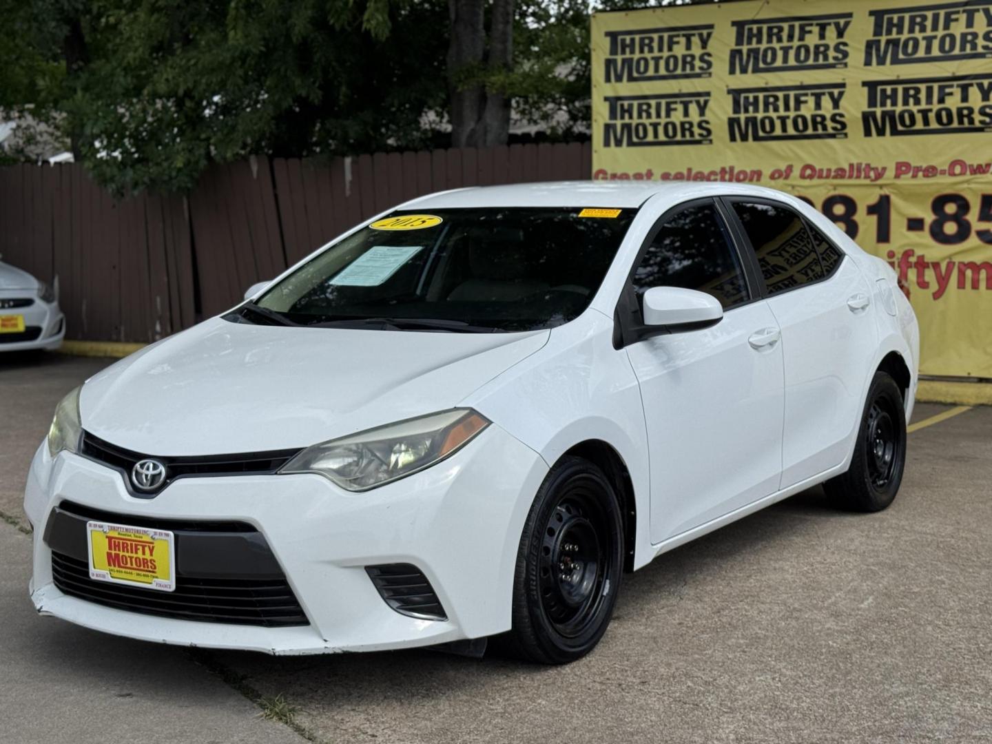 2015 White /Tan Toyota Corolla L 4-Speed AT (2T1BURHE9FC) with an 1.8L L4 DOHC 16V engine, 4-Speed Automatic transmission, located at 16710 Clay Rd., Houston, TX, 77084, (281) 859-7900, 29.834864, -95.656166 - Photo#1
