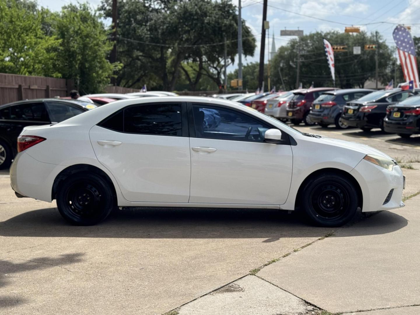 2015 White /Tan Toyota Corolla L 4-Speed AT (2T1BURHE9FC) with an 1.8L L4 DOHC 16V engine, 4-Speed Automatic transmission, located at 16710 Clay Rd., Houston, TX, 77084, (281) 859-7900, 29.834864, -95.656166 - Photo#3
