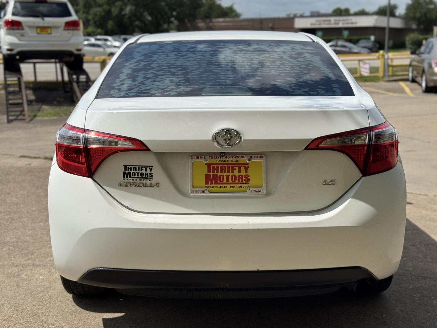 2015 White /Tan Toyota Corolla L 4-Speed AT (2T1BURHE9FC) with an 1.8L L4 DOHC 16V engine, 4-Speed Automatic transmission, located at 16710 Clay Rd., Houston, TX, 77084, (281) 859-7900, 29.834864, -95.656166 - Photo#5