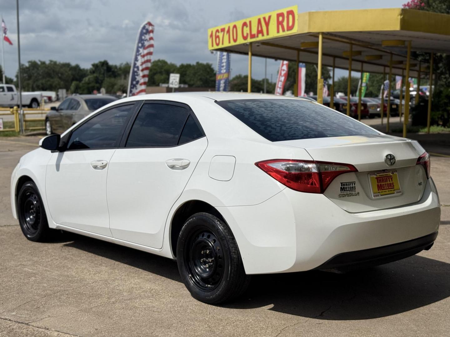 2015 White /Tan Toyota Corolla L 4-Speed AT (2T1BURHE9FC) with an 1.8L L4 DOHC 16V engine, 4-Speed Automatic transmission, located at 16710 Clay Rd., Houston, TX, 77084, (281) 859-7900, 29.834864, -95.656166 - Photo#7