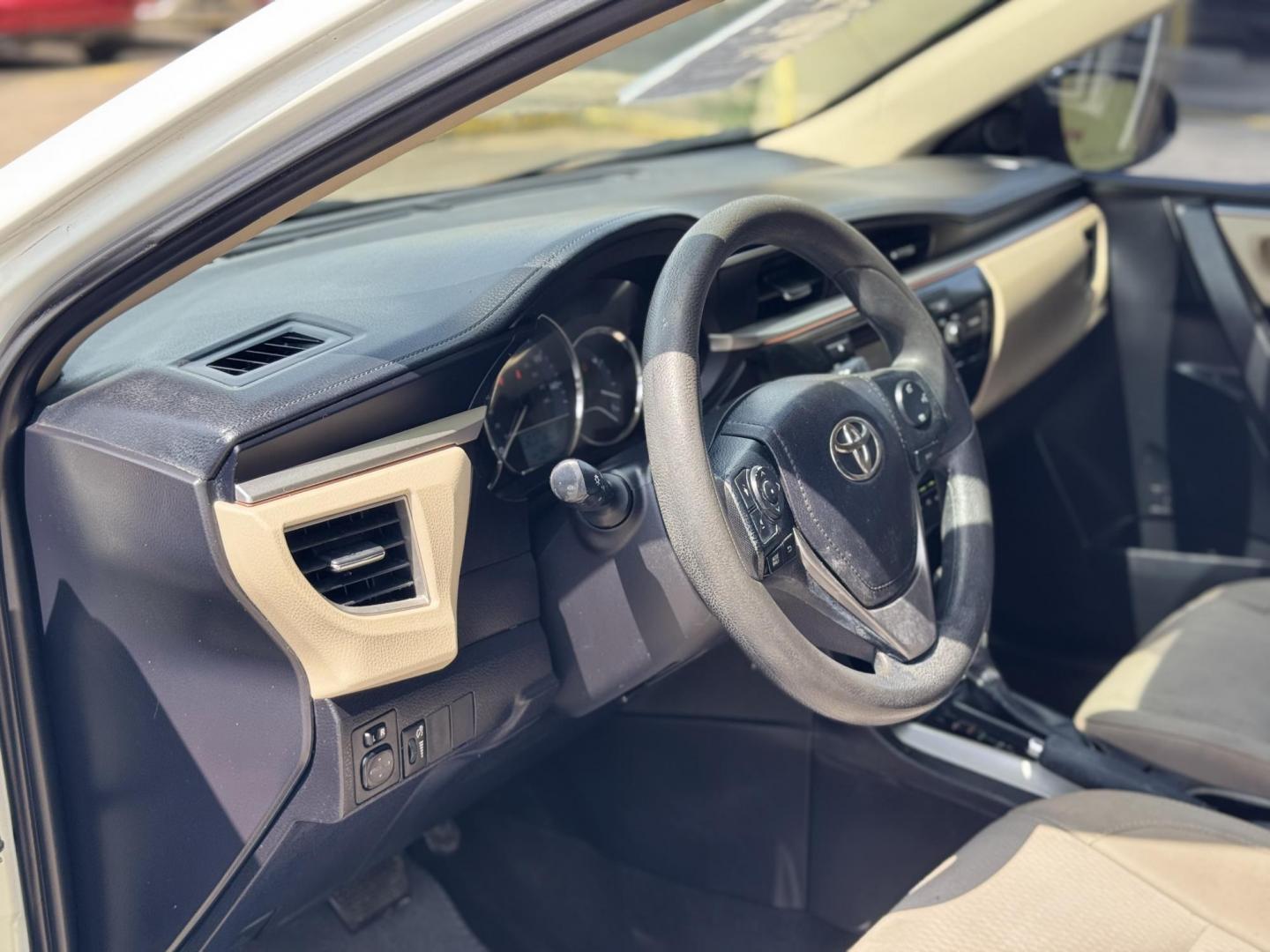 2015 White /Tan Toyota Corolla L 4-Speed AT (2T1BURHE9FC) with an 1.8L L4 DOHC 16V engine, 4-Speed Automatic transmission, located at 16710 Clay Rd., Houston, TX, 77084, (281) 859-7900, 29.834864, -95.656166 - Photo#8