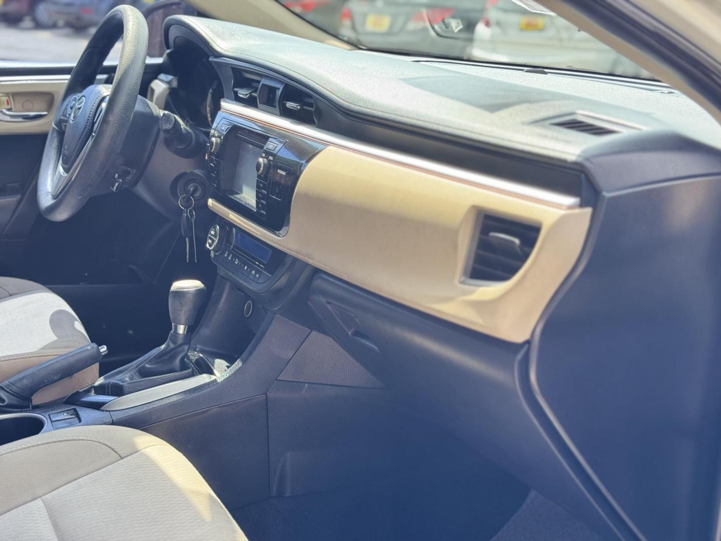 2015 White /Tan Toyota Corolla L 4-Speed AT (2T1BURHE9FC) with an 1.8L L4 DOHC 16V engine, 4-Speed Automatic transmission, located at 16710 Clay Rd., Houston, TX, 77084, (281) 859-7900, 29.834864, -95.656166 - Photo#15