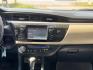 2015 White /Tan Toyota Corolla L 4-Speed AT (2T1BURHE9FC) with an 1.8L L4 DOHC 16V engine, 4-Speed Automatic transmission, located at 16710 Clay Rd., Houston, TX, 77084, (281) 859-7900, 29.834864, -95.656166 - Photo#16