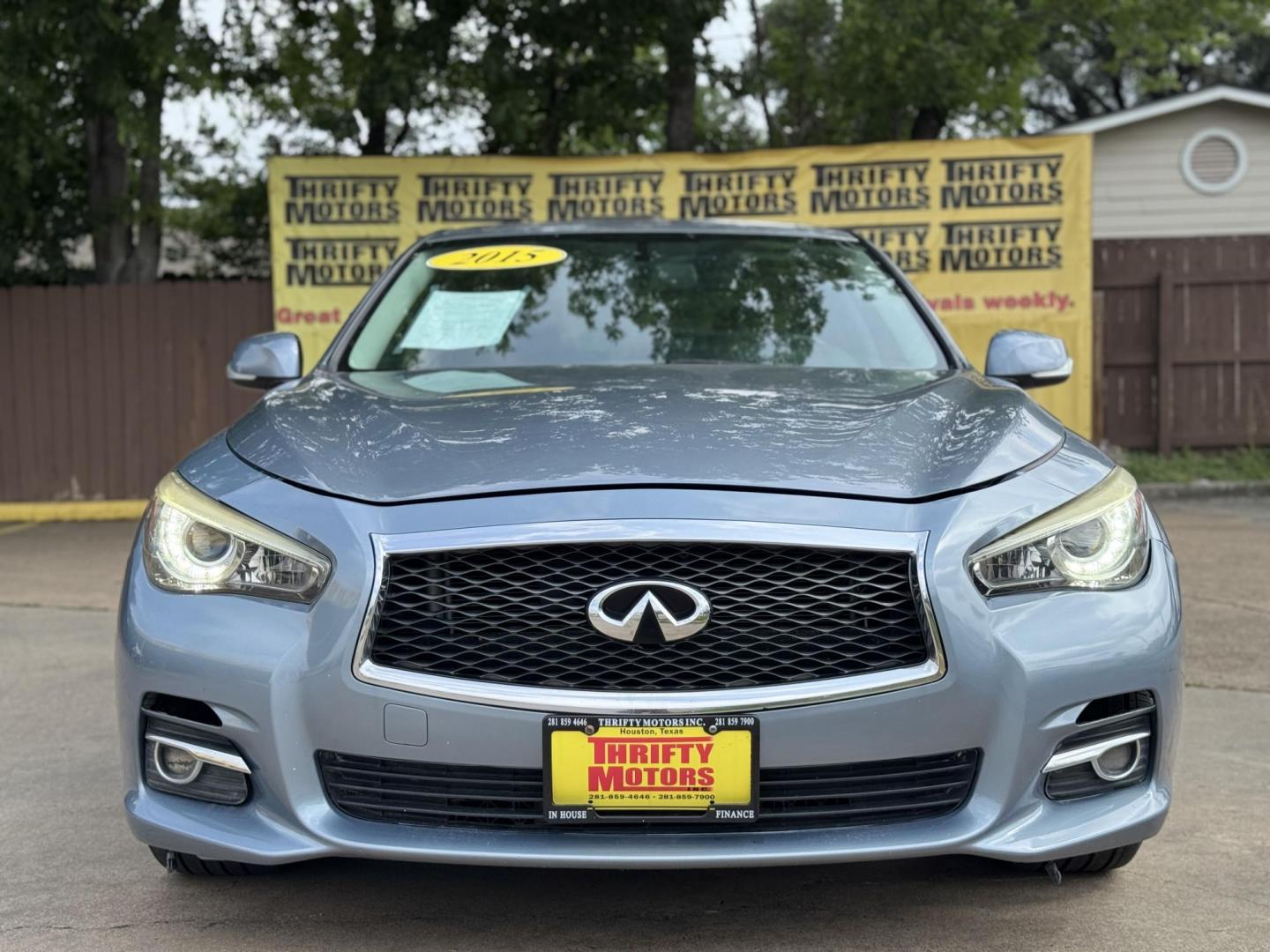 2015 Blue /Black Infiniti Q50 Premium (JN1BV7APXFM) with an 3.7L V6 DOHC 24V HYBRID engine, 7-Speed Automatic transmission, located at 16710 Clay Rd., Houston, TX, 77084, (281) 859-7900, 29.834864, -95.656166 - Photo#0