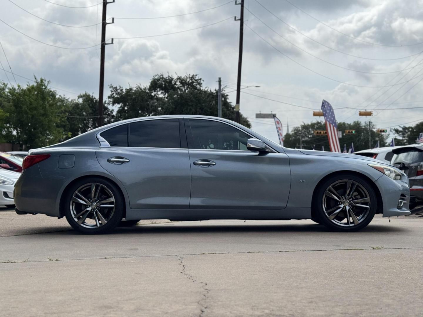 2015 Blue /Black Infiniti Q50 Premium (JN1BV7APXFM) with an 3.7L V6 DOHC 24V HYBRID engine, 7-Speed Automatic transmission, located at 16710 Clay Rd., Houston, TX, 77084, (281) 859-7900, 29.834864, -95.656166 - Photo#3