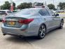 2015 Blue /Black Infiniti Q50 Premium (JN1BV7APXFM) with an 3.7L V6 DOHC 24V HYBRID engine, 7-Speed Automatic transmission, located at 16710 Clay Rd., Houston, TX, 77084, (281) 859-7900, 29.834864, -95.656166 - Photo#4