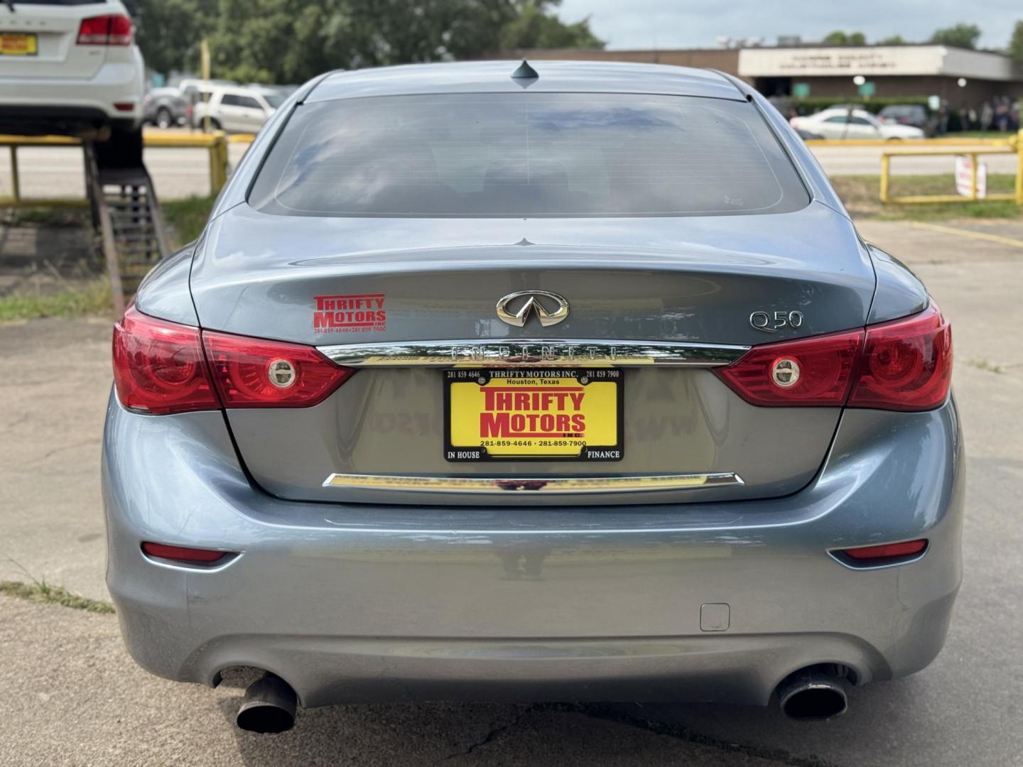 2015 Blue /Black Infiniti Q50 Premium (JN1BV7APXFM) with an 3.7L V6 DOHC 24V HYBRID engine, 7-Speed Automatic transmission, located at 16710 Clay Rd., Houston, TX, 77084, (281) 859-7900, 29.834864, -95.656166 - Photo#5