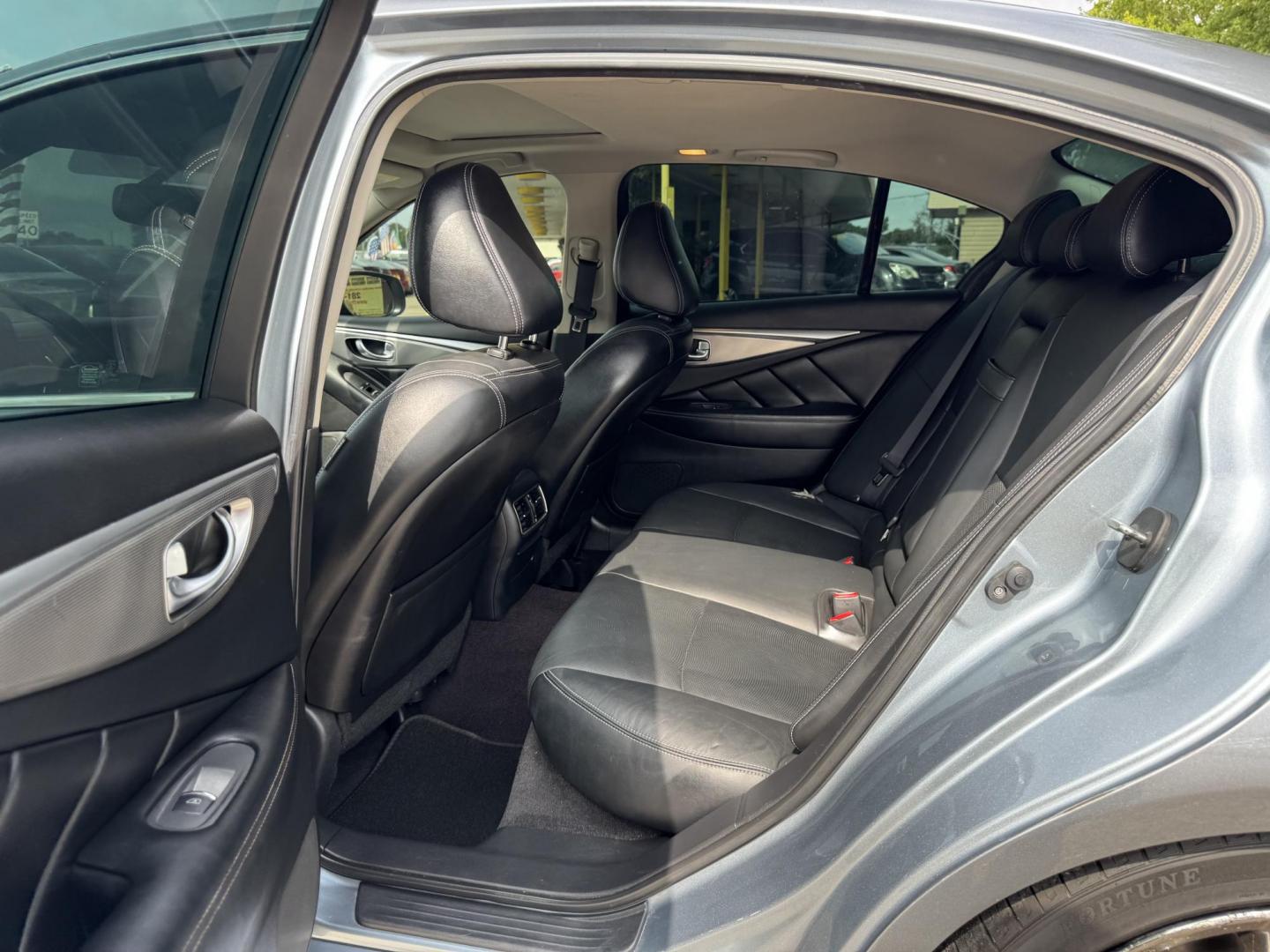 2015 Blue /Black Infiniti Q50 Premium (JN1BV7APXFM) with an 3.7L V6 DOHC 24V HYBRID engine, 7-Speed Automatic transmission, located at 16710 Clay Rd., Houston, TX, 77084, (281) 859-7900, 29.834864, -95.656166 - Photo#13