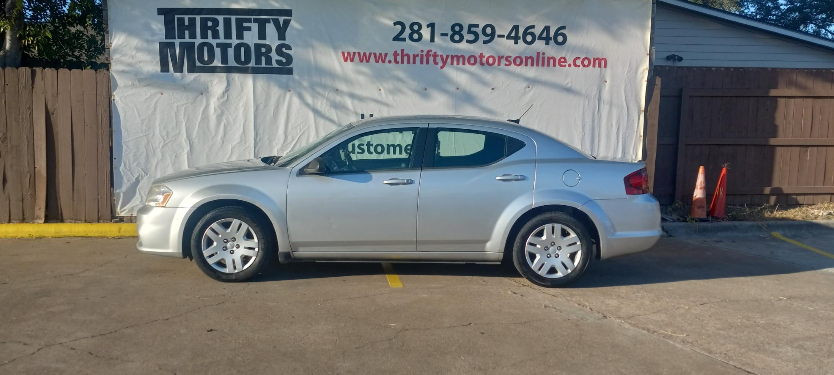 2012 Silver Dodge Avenger (1C3CDZAB4CN) with an 2.4L I4 2.4L I4 engine, Automatic 4-Speed transmission, located at 16710 Clay Rd., Houston, TX, 77084, (281) 859-7900, 29.834864, -95.656166 - Low Down. Low Payments. - Photo #0