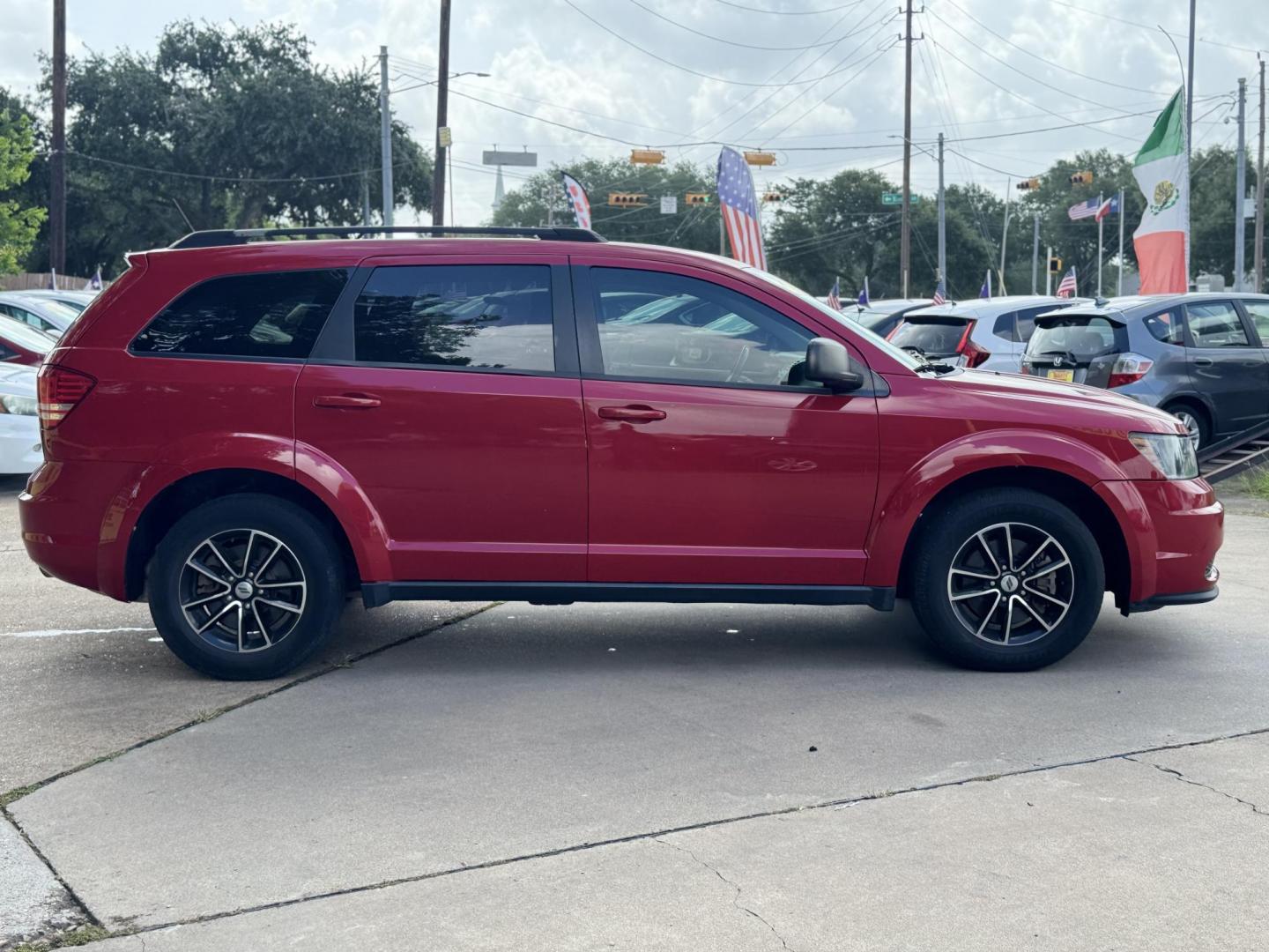 2018 Red Dodge Journey SE (3C4PDCAB5JT) with an 2.4L L4 DOHC 16V engine, 4A transmission, located at 16710 Clay Rd., Houston, TX, 77084, (281) 859-7900, 29.834864, -95.656166 - Photo#3