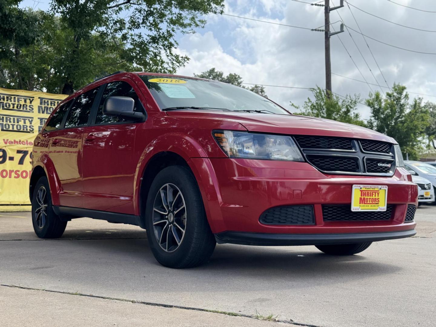 2018 Red Dodge Journey SE (3C4PDCAB5JT) with an 2.4L L4 DOHC 16V engine, 4A transmission, located at 16710 Clay Rd., Houston, TX, 77084, (281) 859-7900, 29.834864, -95.656166 - Photo#4