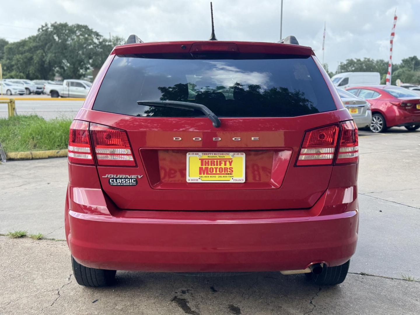 2018 Red Dodge Journey SE (3C4PDCAB5JT) with an 2.4L L4 DOHC 16V engine, 4A transmission, located at 16710 Clay Rd., Houston, TX, 77084, (281) 859-7900, 29.834864, -95.656166 - Photo#5