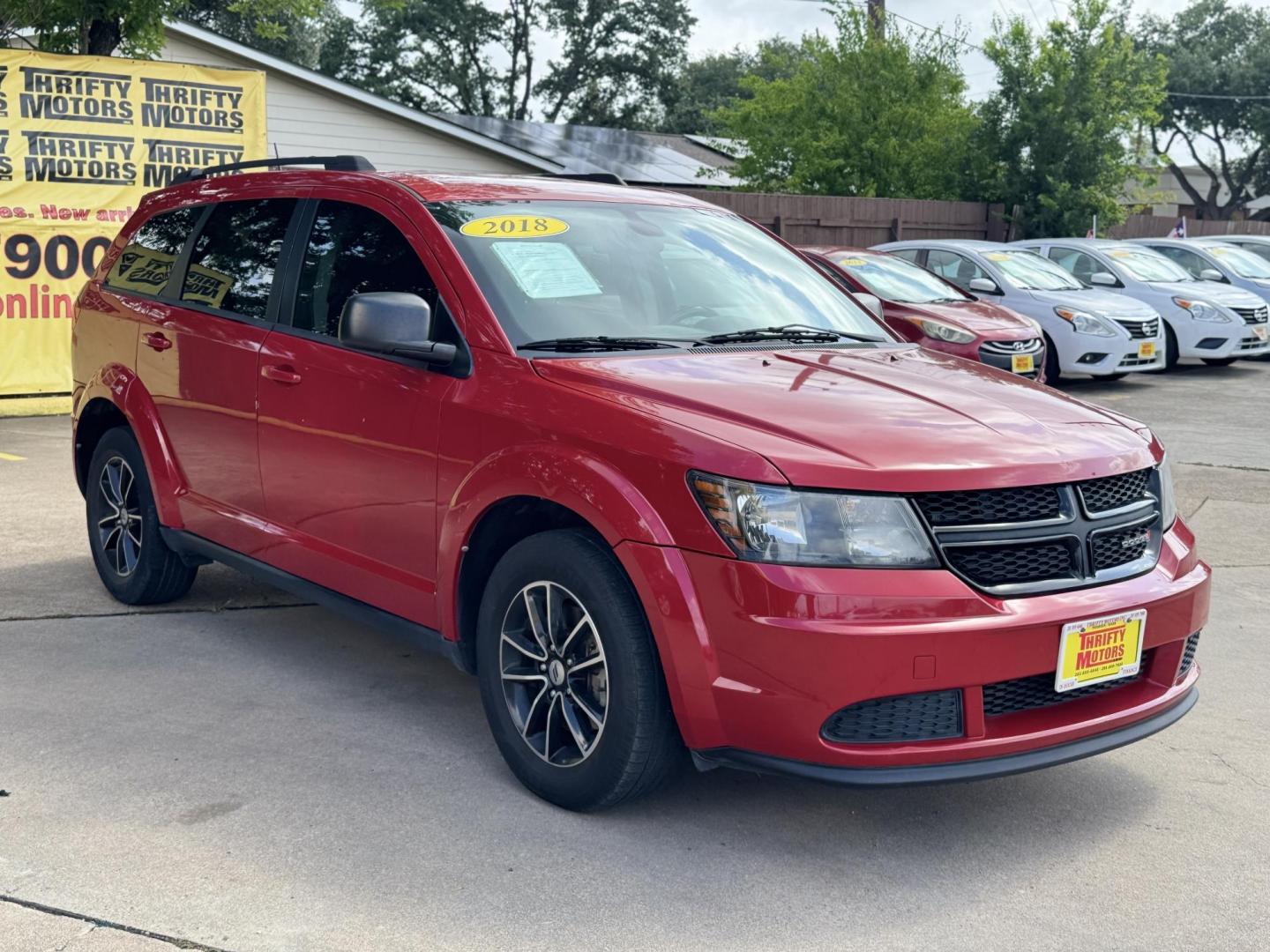 2018 Red Dodge Journey SE (3C4PDCAB5JT) with an 2.4L L4 DOHC 16V engine, 4A transmission, located at 16710 Clay Rd., Houston, TX, 77084, (281) 859-7900, 29.834864, -95.656166 - Photo#6