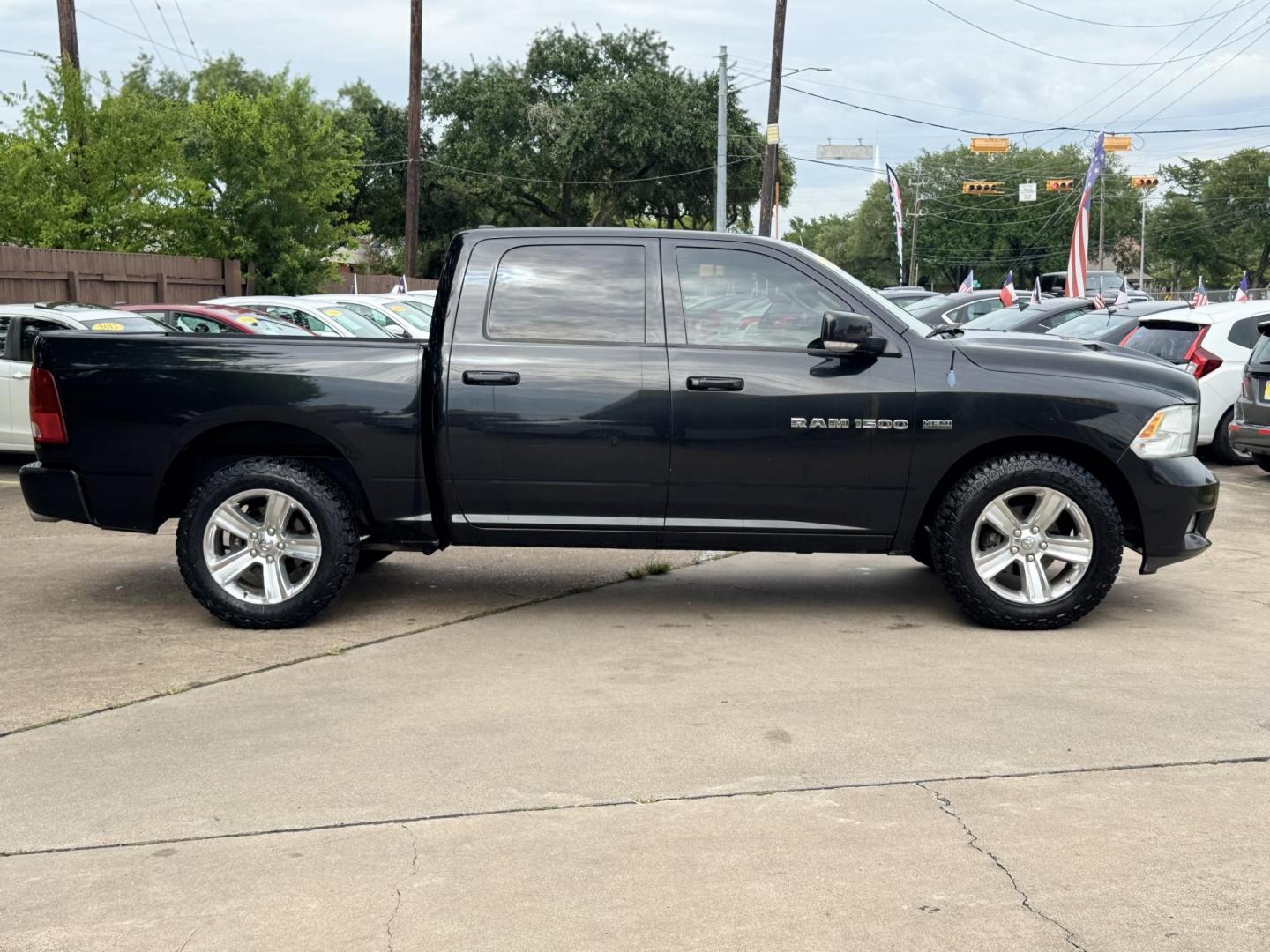 2011 Black Dodge Ram 1500 SLT Crew Cab 2WD (1D7RB1CT8BS) with an 5.7L V8 OHV 16V engine, 5-Speed Automatic transmission, located at 16710 Clay Rd., Houston, TX, 77084, (281) 859-7900, 29.834864, -95.656166 - Photo#4