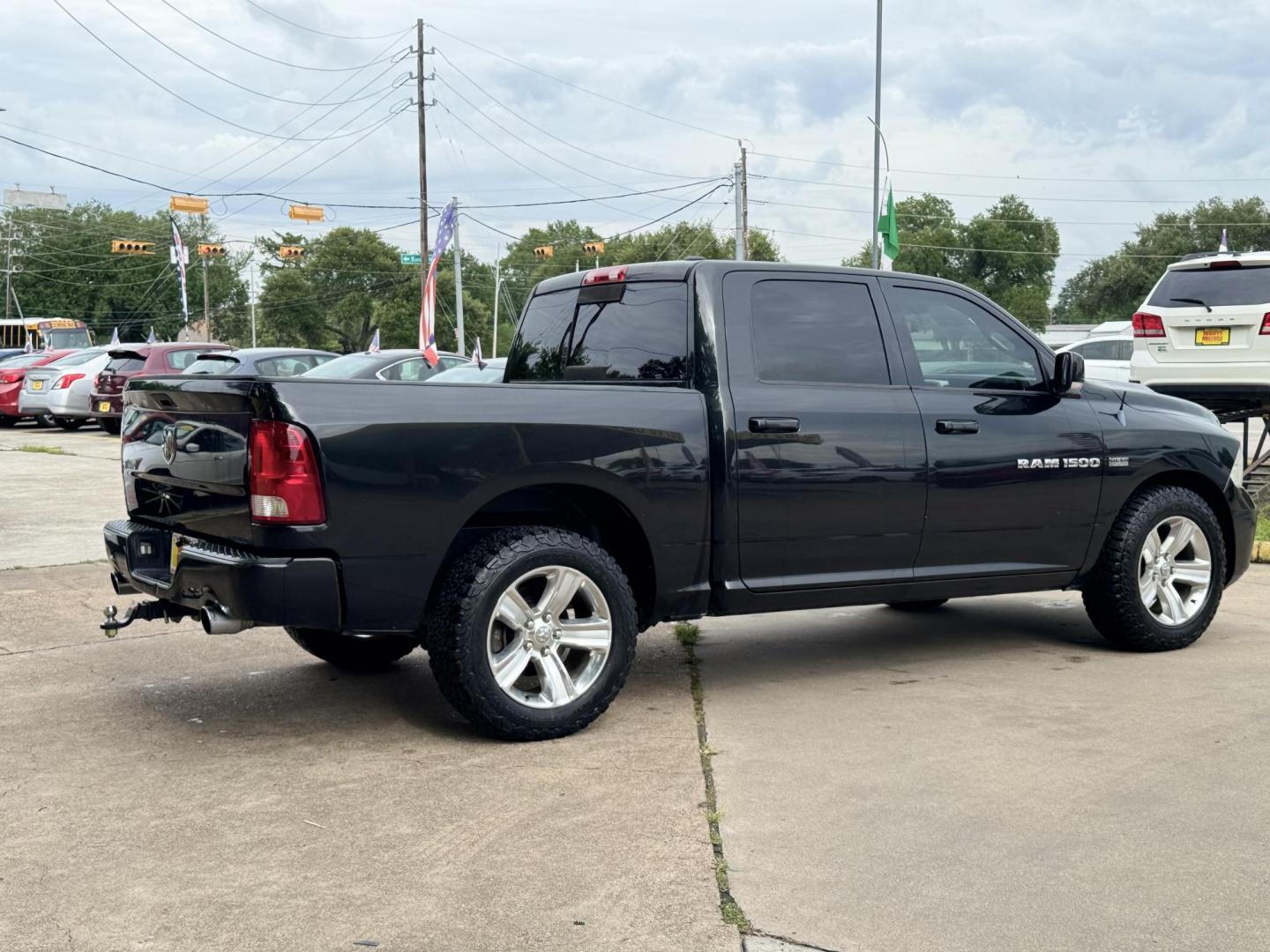2011 Black Dodge Ram 1500 SLT Crew Cab 2WD (1D7RB1CT8BS) with an 5.7L V8 OHV 16V engine, 5-Speed Automatic transmission, located at 16710 Clay Rd., Houston, TX, 77084, (281) 859-7900, 29.834864, -95.656166 - Photo#2