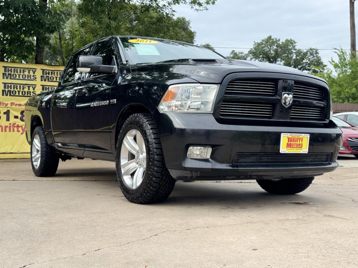 2011 Black Dodge Ram 1500 SLT Crew Cab 2WD (1D7RB1CT8BS) with an 5.7L V8 OHV 16V engine, 5-Speed Automatic transmission, located at 16710 Clay Rd., Houston, TX, 77084, (281) 859-7900, 29.834864, -95.656166 - Photo#7
