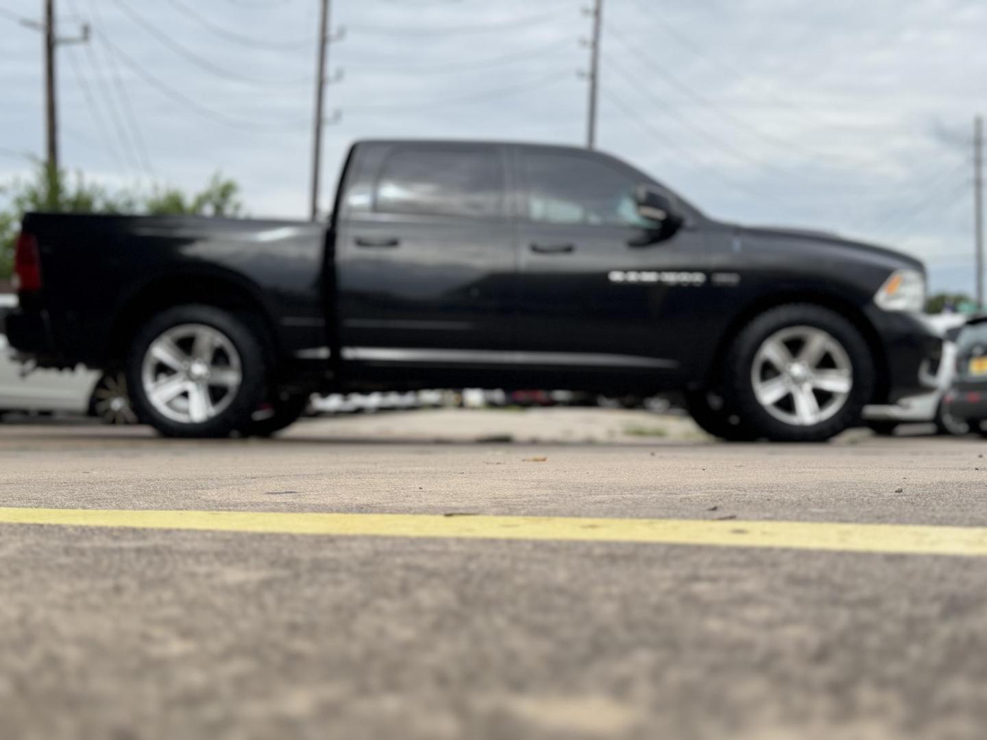 2011 Black Dodge Ram 1500 SLT Crew Cab 2WD (1D7RB1CT8BS) with an 5.7L V8 OHV 16V engine, 5-Speed Automatic transmission, located at 16710 Clay Rd., Houston, TX, 77084, (281) 859-7900, 29.834864, -95.656166 - Photo#10