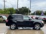 2009 Black /black Ford Escape Limited FWD V6 (1FMCU04GX9K) with an 3.0L V6 DOHC 24V engine, 4-Speed Automatic transmission, located at 16710 Clay Rd., Houston, TX, 77084, (281) 859-7900, 29.834864, -95.656166 - Photo#2