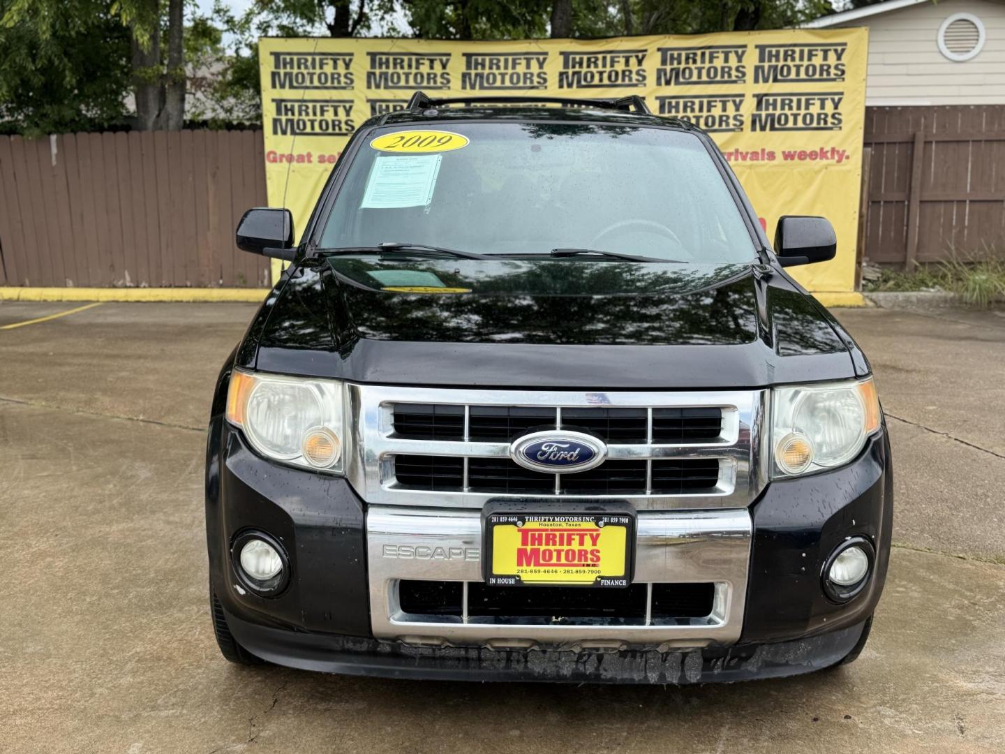 2009 Black /black Ford Escape Limited FWD V6 (1FMCU04GX9K) with an 3.0L V6 DOHC 24V engine, 4-Speed Automatic transmission, located at 16710 Clay Rd., Houston, TX, 77084, (281) 859-7900, 29.834864, -95.656166 - Photo#1