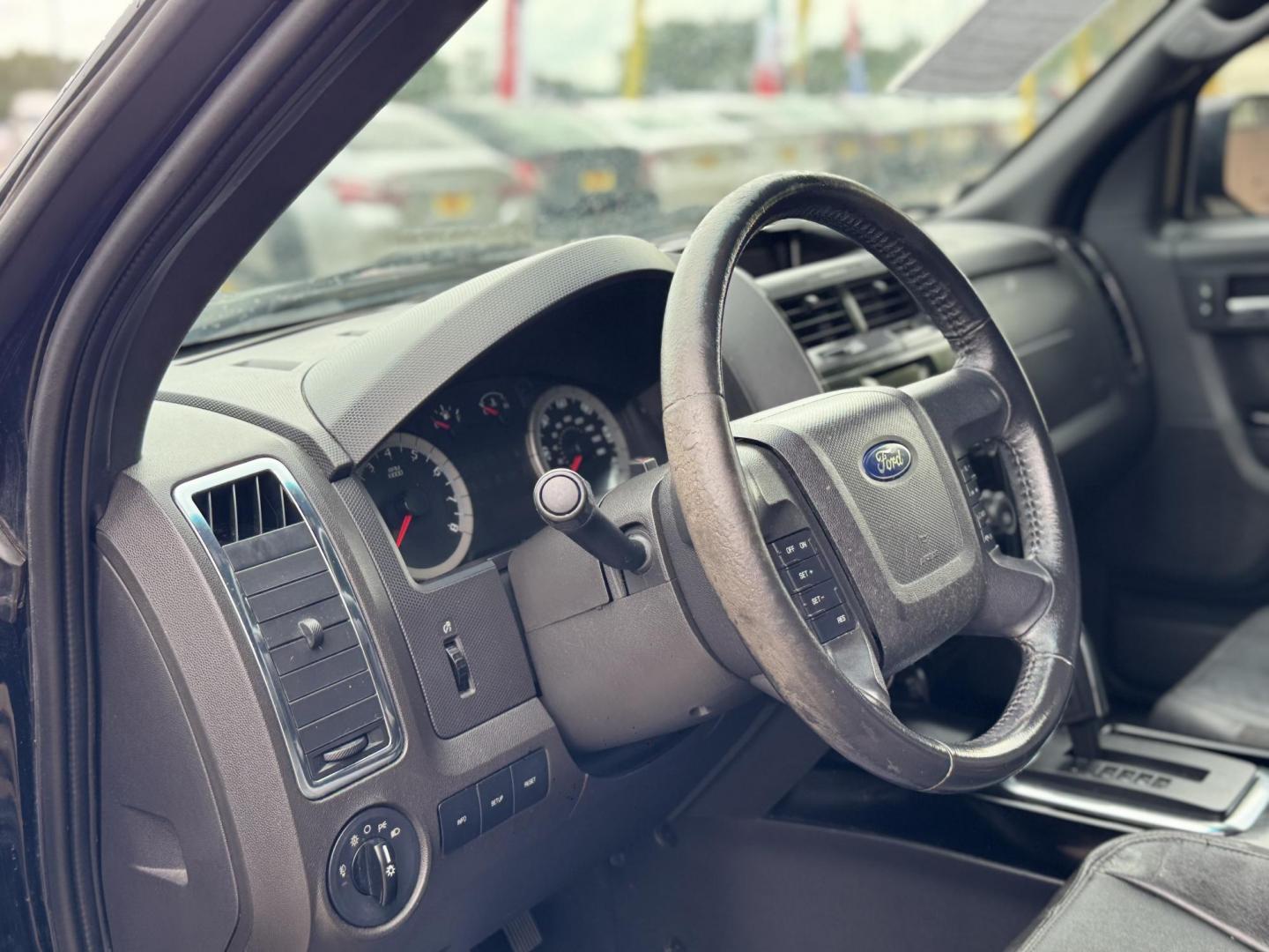 2009 Black /black Ford Escape Limited FWD V6 (1FMCU04GX9K) with an 3.0L V6 DOHC 24V engine, 4-Speed Automatic transmission, located at 16710 Clay Rd., Houston, TX, 77084, (281) 859-7900, 29.834864, -95.656166 - Photo#7