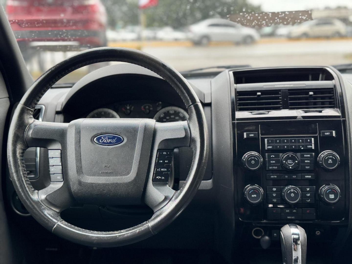 2009 Black /black Ford Escape Limited FWD V6 (1FMCU04GX9K) with an 3.0L V6 DOHC 24V engine, 4-Speed Automatic transmission, located at 16710 Clay Rd., Houston, TX, 77084, (281) 859-7900, 29.834864, -95.656166 - Photo#11