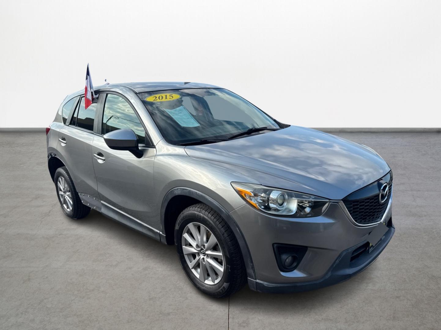 2015 Mazda CX-5 Touring (JM3KE2CY1F0) with an 2.5L L4 DOHC 16V engine, 6-Speed Automatic transmission, located at 16710 Clay Rd., Houston, TX, 77084, (281) 859-7900, 29.834864, -95.656166 - Photo#2