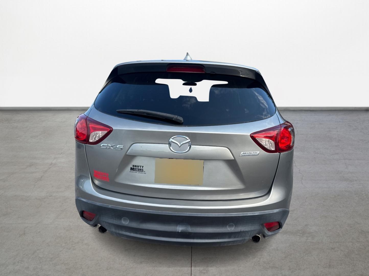 2015 Mazda CX-5 Touring (JM3KE2CY1F0) with an 2.5L L4 DOHC 16V engine, 6-Speed Automatic transmission, located at 16710 Clay Rd., Houston, TX, 77084, (281) 859-7900, 29.834864, -95.656166 - Photo#5