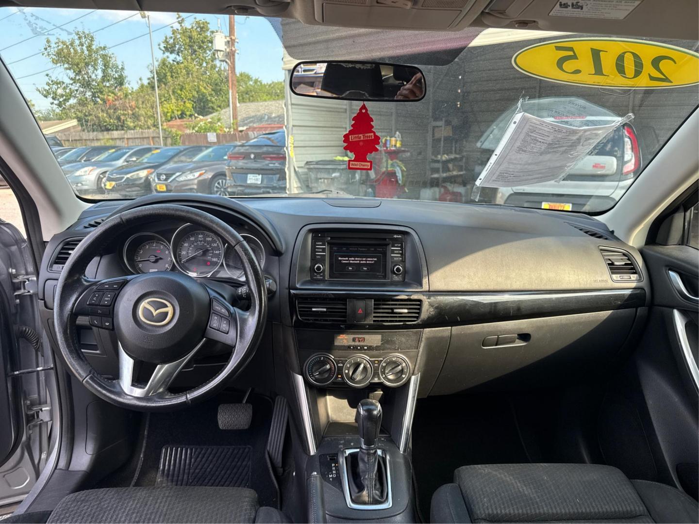 2015 Mazda CX-5 Touring (JM3KE2CY1F0) with an 2.5L L4 DOHC 16V engine, 6-Speed Automatic transmission, located at 16710 Clay Rd., Houston, TX, 77084, (281) 859-7900, 29.834864, -95.656166 - Photo#12