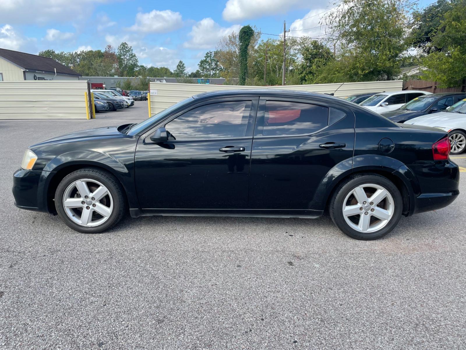 2013 Black Dodge Avenger (1C3CDZAB8DN) with an 2.4L I4 2.4L I4 engine, Automatic 4-Speed transmission, located at 16710 Clay Rd., Houston, TX, 77084, (281) 859-7900, 29.834864, -95.656166 - Photo #0