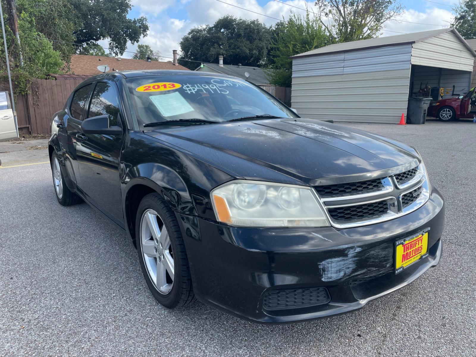 2013 Black Dodge Avenger (1C3CDZAB8DN) with an 2.4L I4 2.4L I4 engine, Automatic 4-Speed transmission, located at 16710 Clay Rd., Houston, TX, 77084, (281) 859-7900, 29.834864, -95.656166 - Photo #1