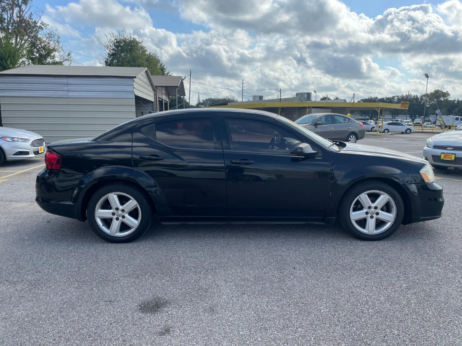 2013 Black Dodge Avenger (1C3CDZAB8DN) with an 2.4L I4 2.4L I4 engine, Automatic 4-Speed transmission, located at 16710 Clay Rd., Houston, TX, 77084, (281) 859-7900, 29.834864, -95.656166 - Photo #2