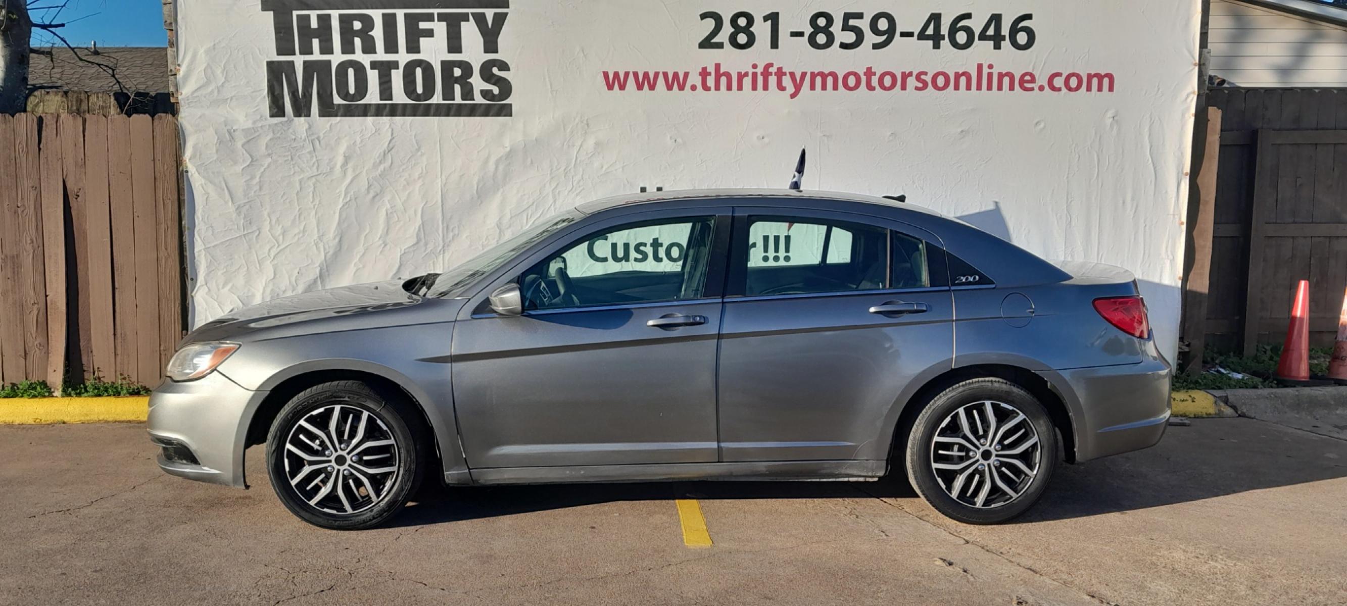 2012 Gray Chrysler 200 (1C3CCBAB1CN) with an 2.4L I4 2.4L I4 engine, Automatic 6-Speed transmission, located at 16710 Clay Rd., Houston, TX, 77084, (281) 859-7900, 29.834864, -95.656166 - Low Down. Low Payments. - Photo #0