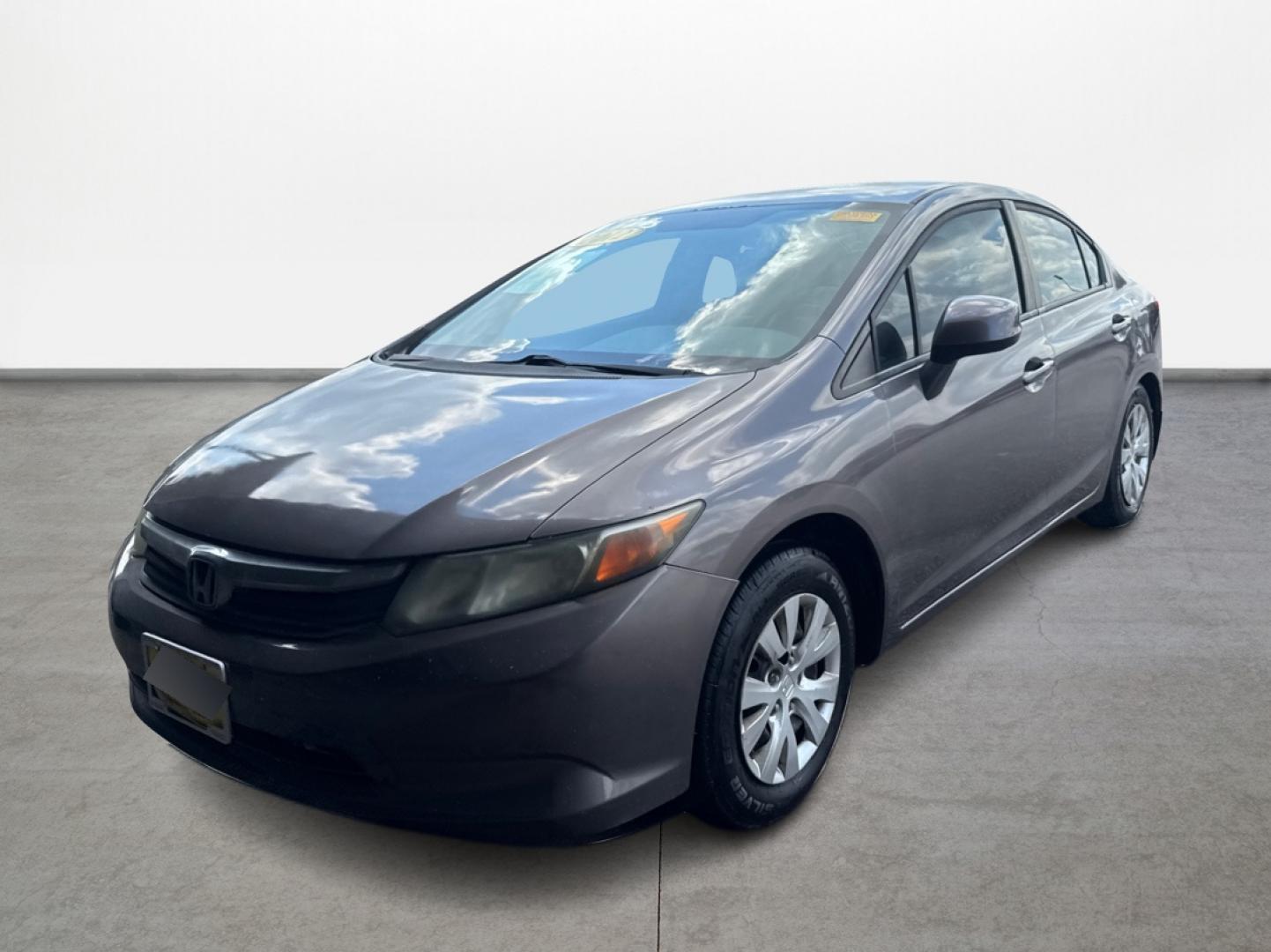 2012 Brown Honda Civic (2HGFB2F5XCH) with an 1.8L I4 1.8L I4 engine, Automatic 5-Speed transmission, located at 16710 Clay Rd., Houston, TX, 77084, (281) 859-7900, 29.834864, -95.656166 - Low Down. Low Payments. - Photo#2