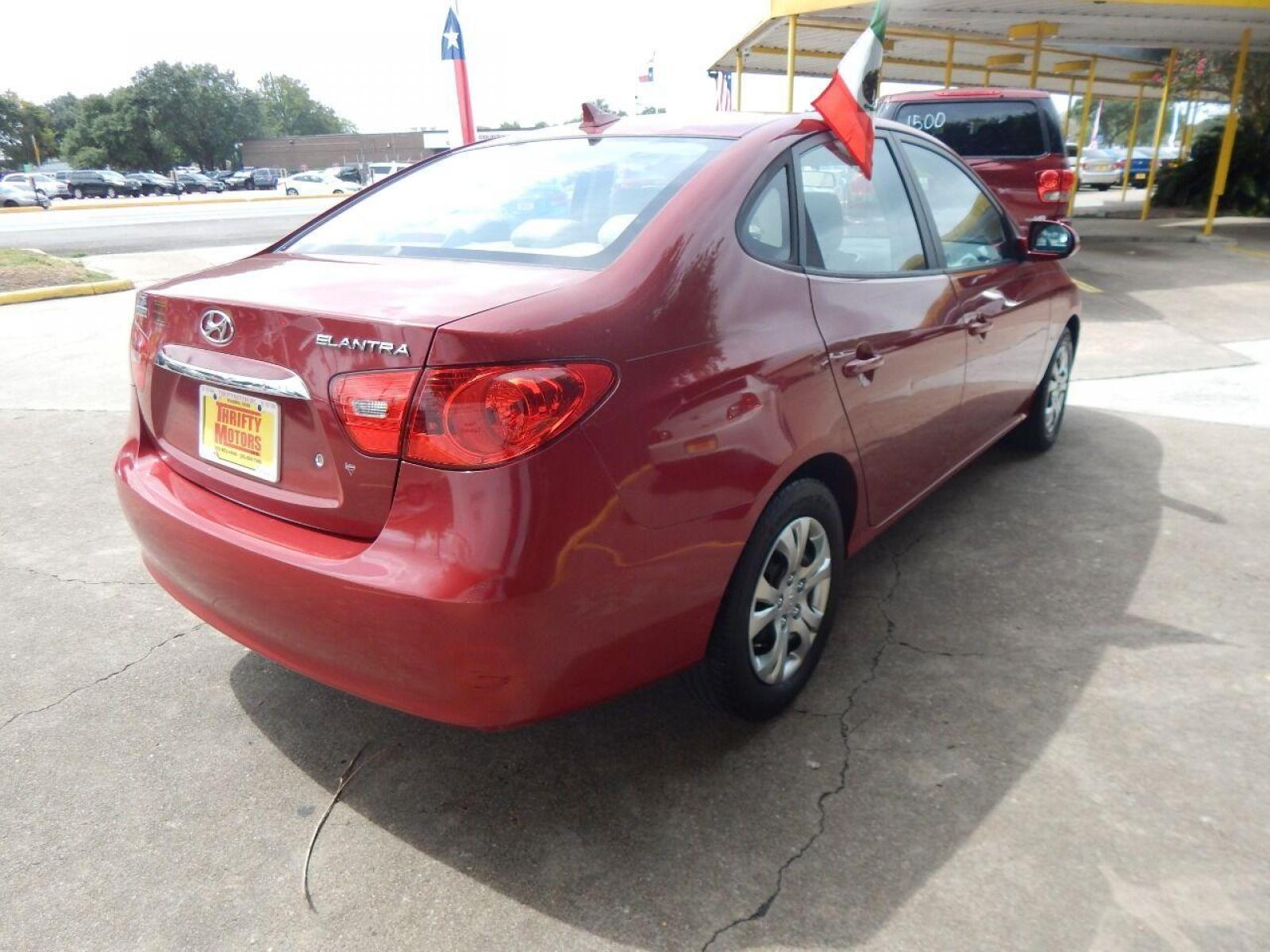 2010 Red Hyundai Elantra (KMHDU4AD7AU) with an 2.0L I4 2.0L I4 engine, Automatic 4-Speed transmission, located at 16710 Clay Rd., Houston, TX, 77084, (281) 859-7900, 29.834864, -95.656166 - Low Down. Low Payments. - Photo #4