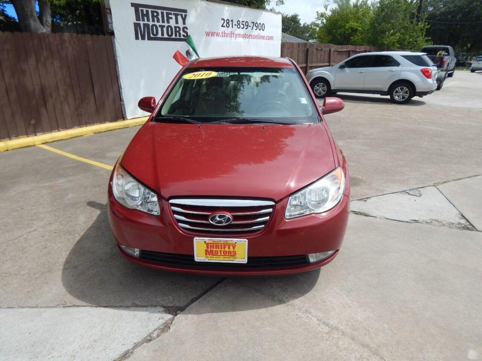 2010 Red Hyundai Elantra (KMHDU4AD7AU) with an 2.0L I4 2.0L I4 engine, Automatic 4-Speed transmission, located at 16710 Clay Rd., Houston, TX, 77084, (281) 859-7900, 29.834864, -95.656166 - Low Down. Low Payments. - Photo #5