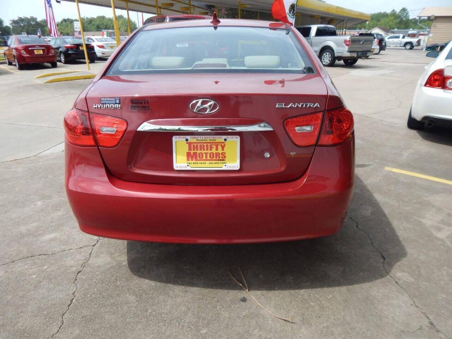 2010 Red Hyundai Elantra (KMHDU4AD7AU) with an 2.0L I4 2.0L I4 engine, Automatic 4-Speed transmission, located at 16710 Clay Rd., Houston, TX, 77084, (281) 859-7900, 29.834864, -95.656166 - Low Down. Low Payments. - Photo#3