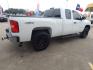 2012 White Chevrolet Silverado 1500 Work Truck Ext. Cab 4WD (1GCRKPEA6CZ) with an 4.8L V8 OHV 16V engine, 4-Speed Automatic transmission, located at 16710 Clay Rd., Houston, TX, 77084, (281) 859-7900, 29.834864, -95.656166 - Photo #5