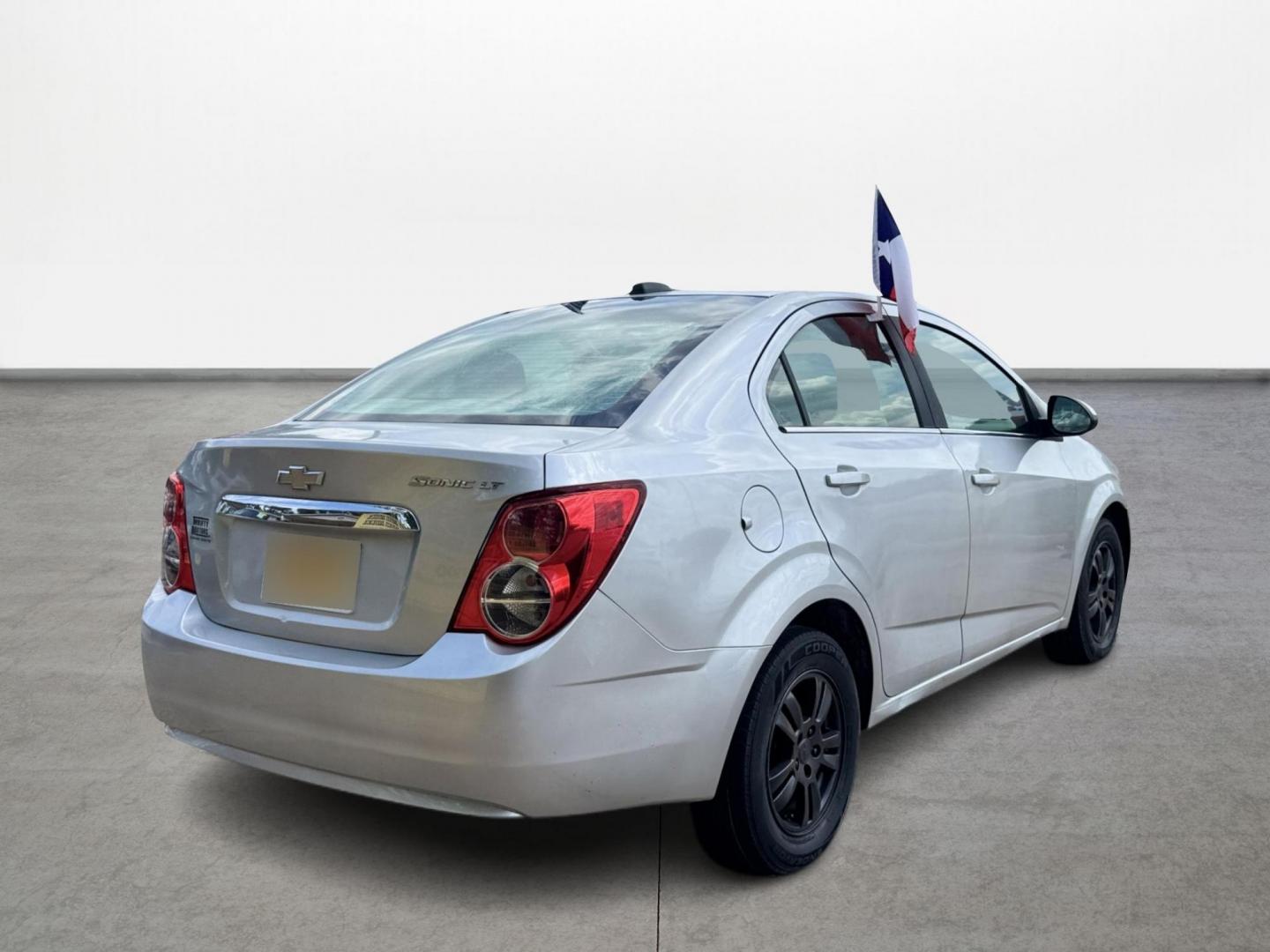 2015 Silver Chevrolet Sonic LT Auto Sedan (1G1JC5SH0F4) with an 1.8L L4 DOHC 24V engine, Automatic transmission, located at 16710 Clay Rd., Houston, TX, 77084, (281) 859-7900, 29.834864, -95.656166 - Low Down. Low Payments. - Photo#4