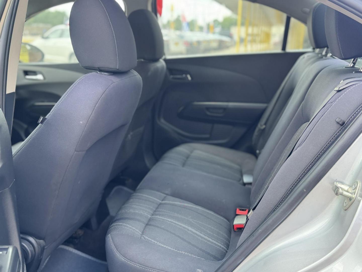 2015 Silver Chevrolet Sonic LT Auto Sedan (1G1JC5SH0F4) with an 1.8L L4 DOHC 24V engine, Automatic transmission, located at 16710 Clay Rd., Houston, TX, 77084, (281) 859-7900, 29.834864, -95.656166 - Low Down. Low Payments. - Photo#12