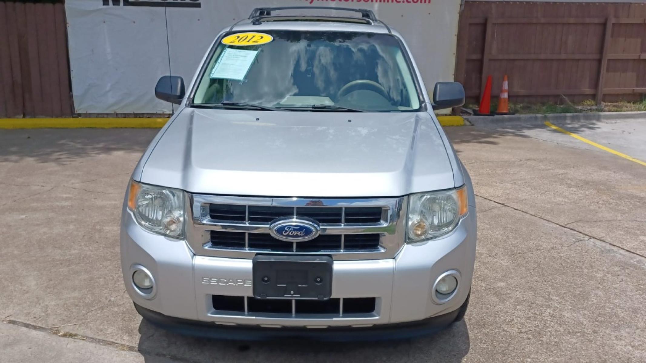 2012 Silver Ford Escape XLT FWD (1FMCU0D78CK) with an 2.5L L4 DOHC 16V engine, 6-Speed Automatic transmission, located at 16710 Clay Rd., Houston, TX, 77084, (281) 859-7900, 29.834864, -95.656166 - Low Down. Low Payments. - Photo #1