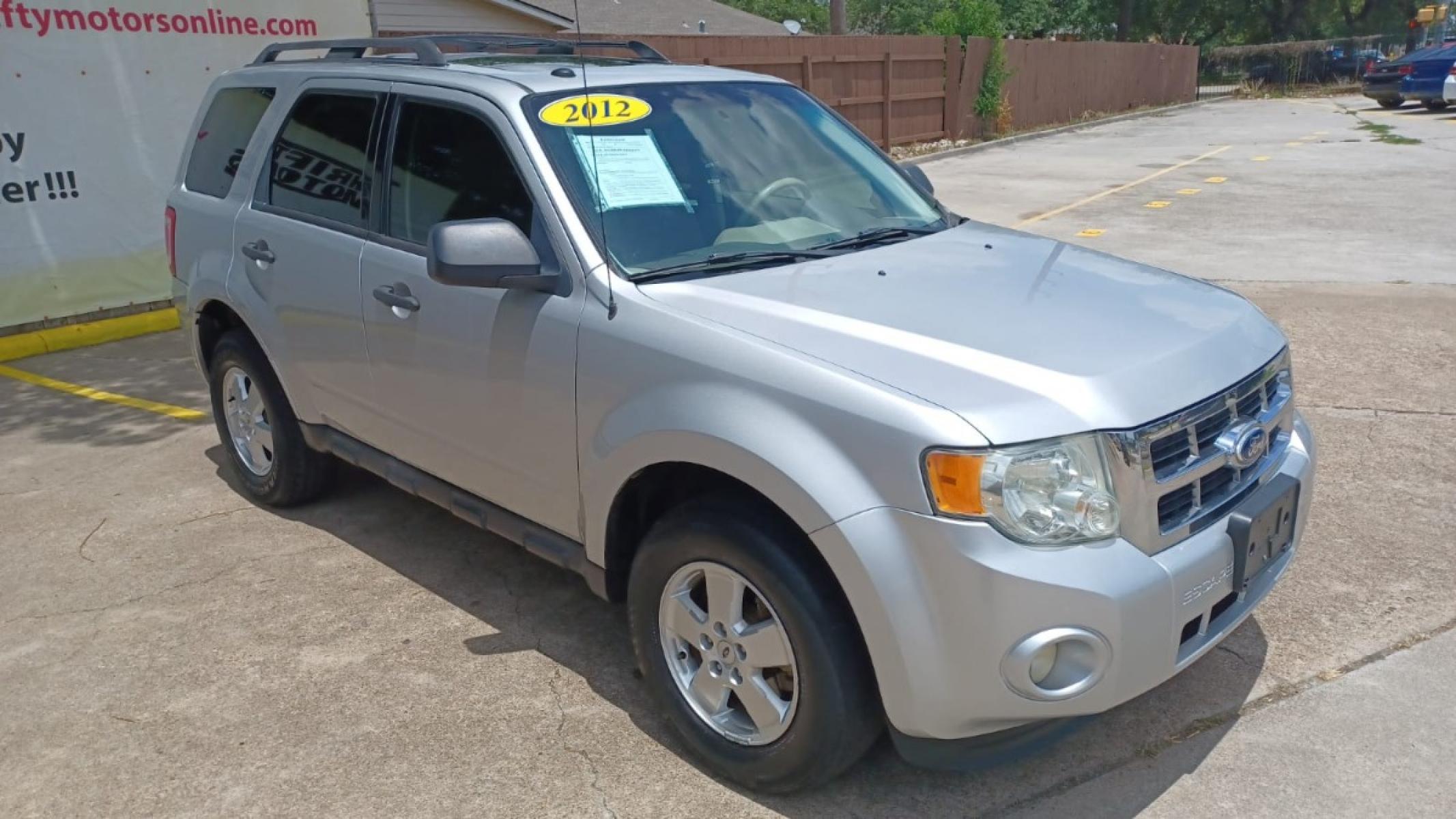 2012 Silver Ford Escape XLT FWD (1FMCU0D78CK) with an 2.5L L4 DOHC 16V engine, 6-Speed Automatic transmission, located at 16710 Clay Rd., Houston, TX, 77084, (281) 859-7900, 29.834864, -95.656166 - Photo #6