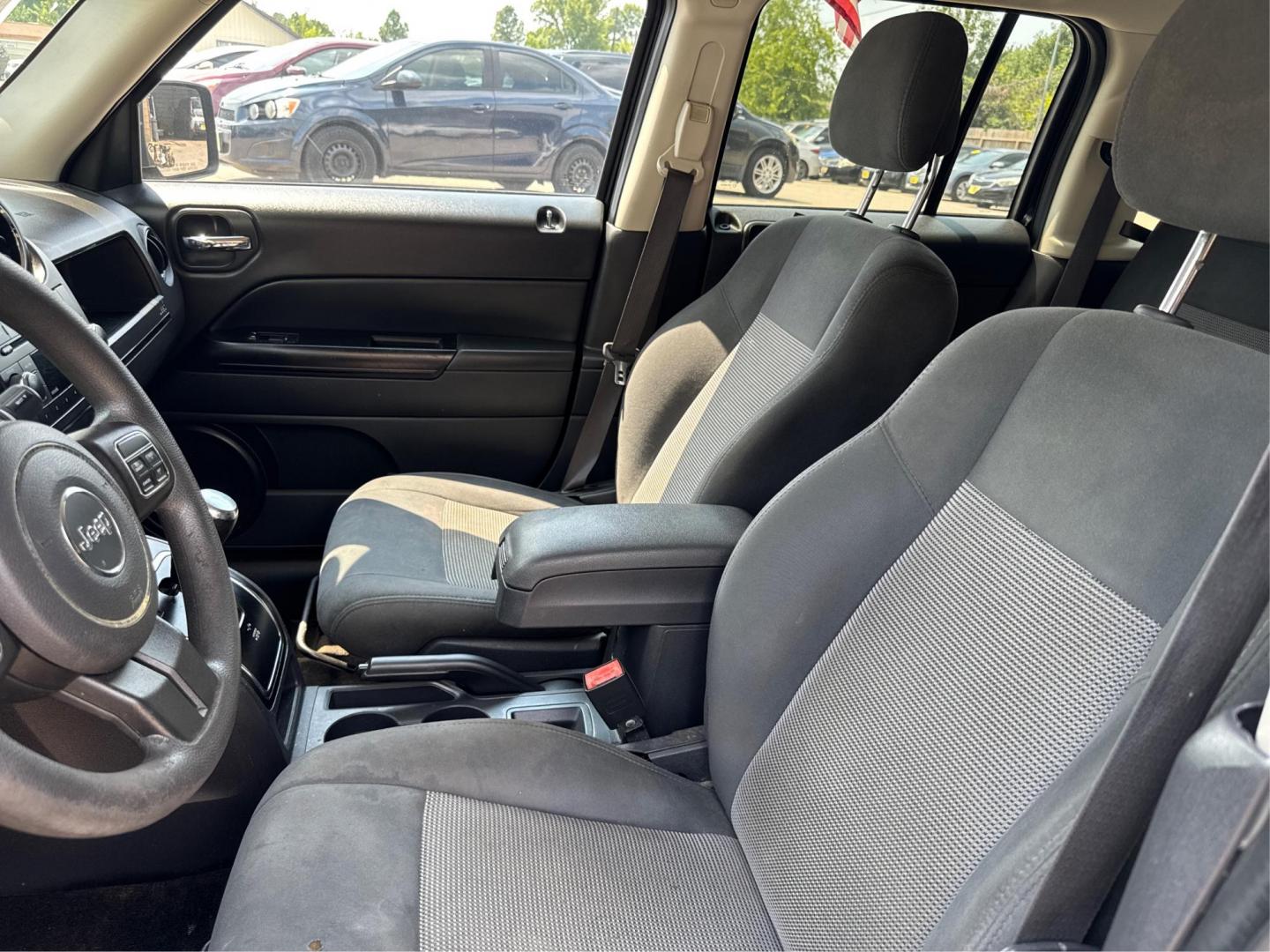 2016 Black Jeep Patriot Sport 2WD (1C4NJPBAXGD) with an 2.0L L4 DOHC 16V engine, located at 16710 Clay Rd., Houston, TX, 77084, (281) 859-7900, 29.834864, -95.656166 - Low Down. Low Payments. - Photo#8
