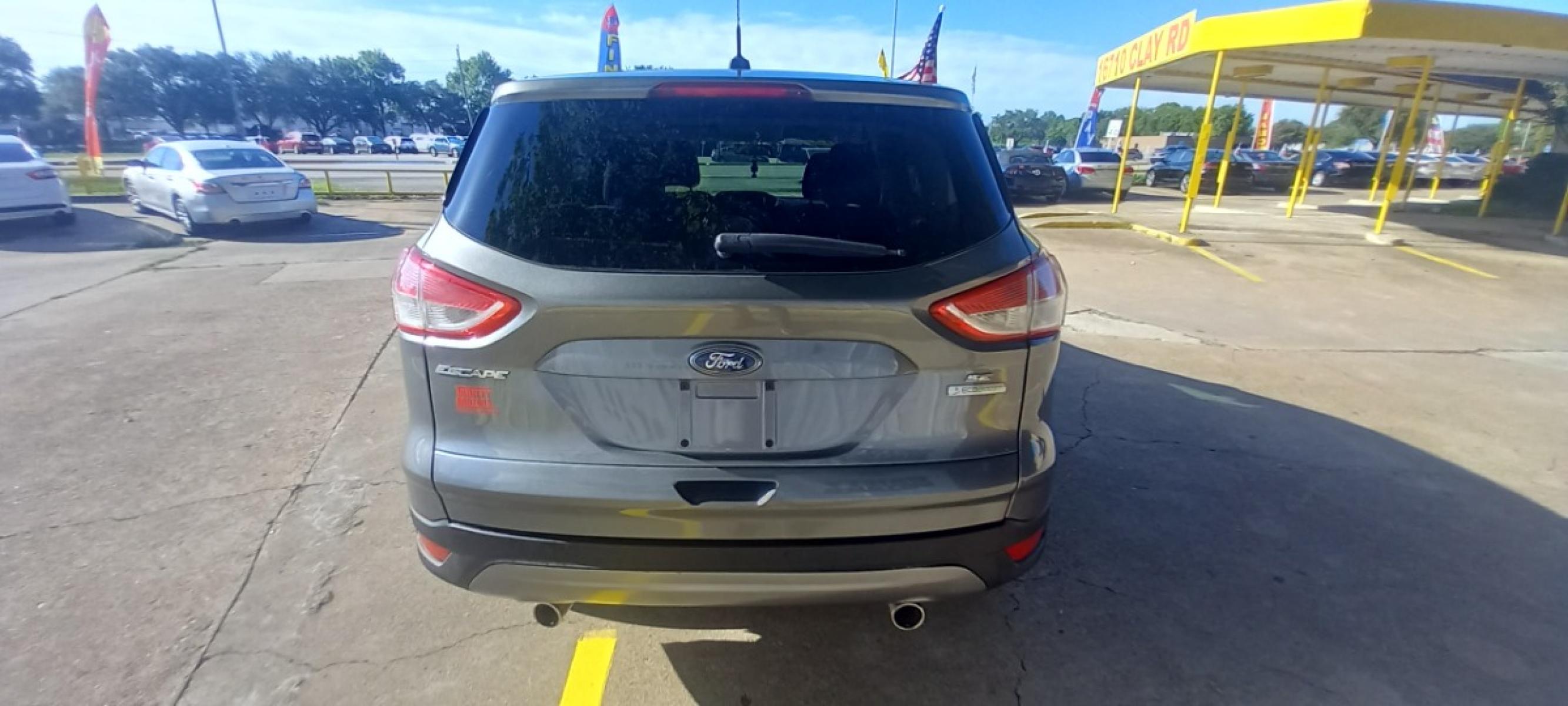 2013 Gray Ford Escape SE FWD (1FMCU0GX6DU) with an 1.6L L4 DOHC 16V engine, 6-Speed Automatic transmission, located at 16710 Clay Rd., Houston, TX, 77084, (281) 859-7900, 29.834864, -95.656166 - Photo #5