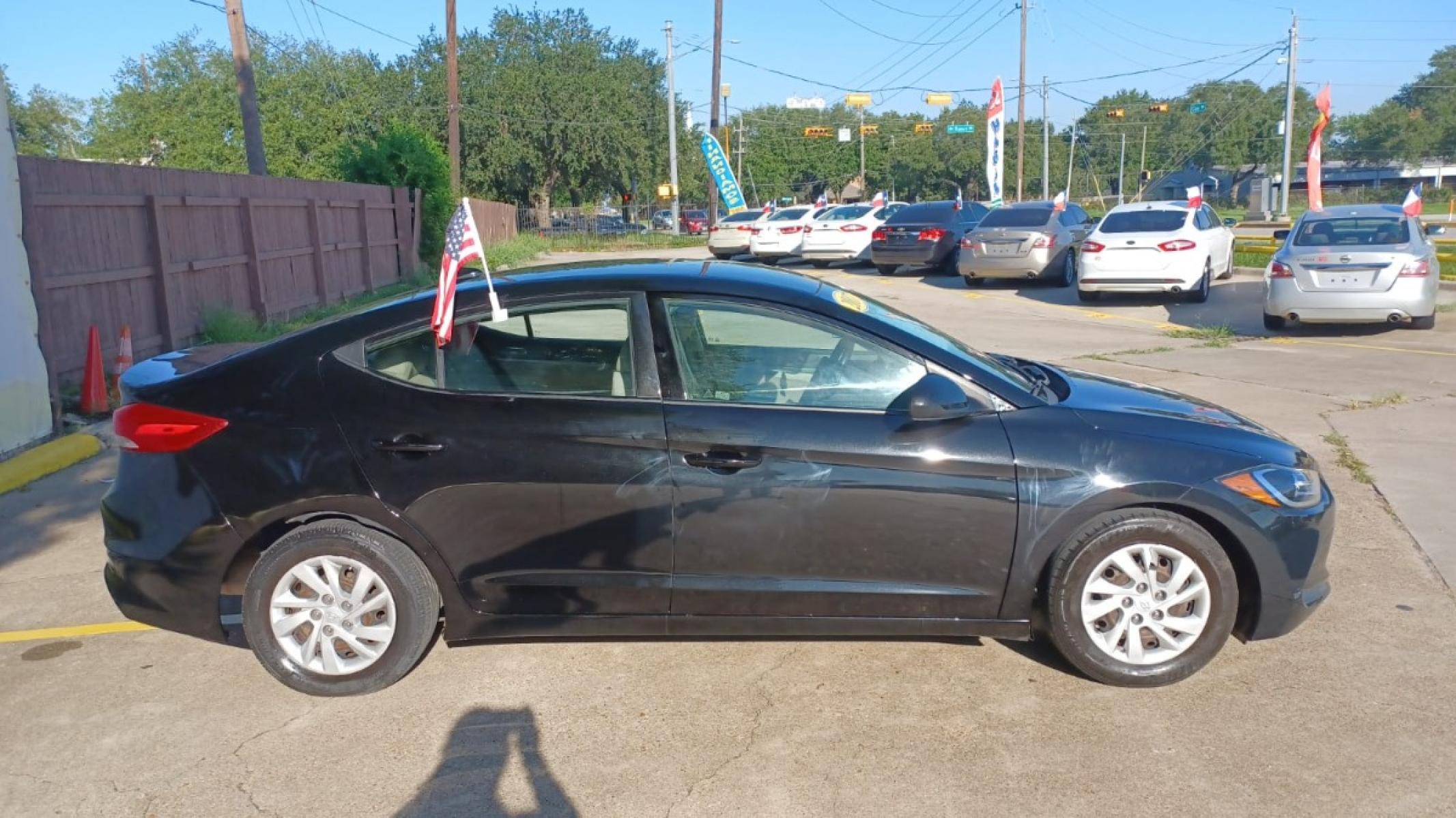 2017 Black Hyundai Elantra SE 6AT (5NPD74LFXHH) with an 1.8L L4 DOHC 16V engine, 6A transmission, located at 16710 Clay Rd., Houston, TX, 77084, (281) 859-7900, 29.834864, -95.656166 - Low Down. Low Payments. - Photo #4